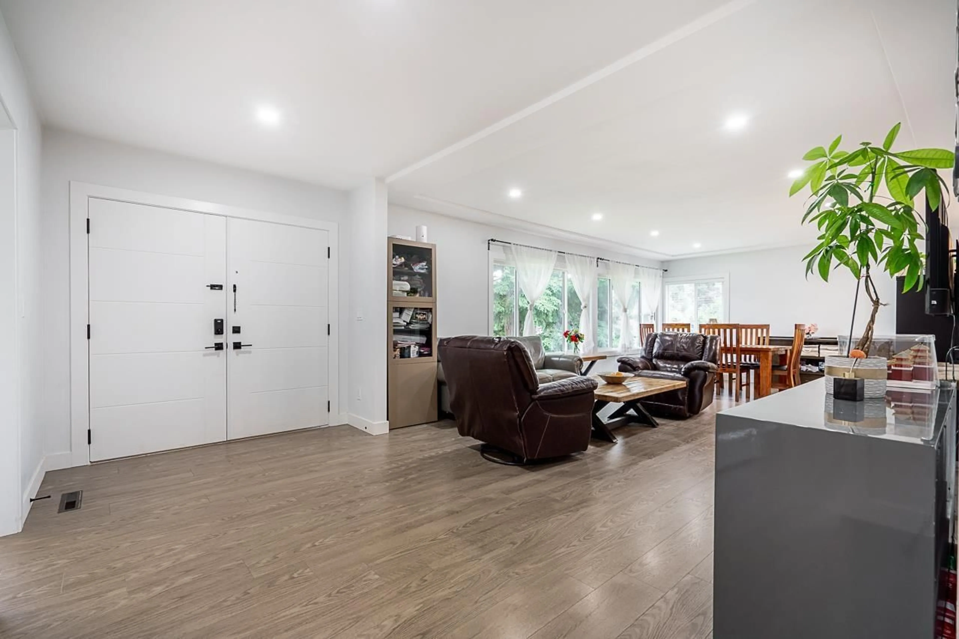 Living room with furniture, wood/laminate floor for 10875 143 STREET, Surrey British Columbia V3R3M1