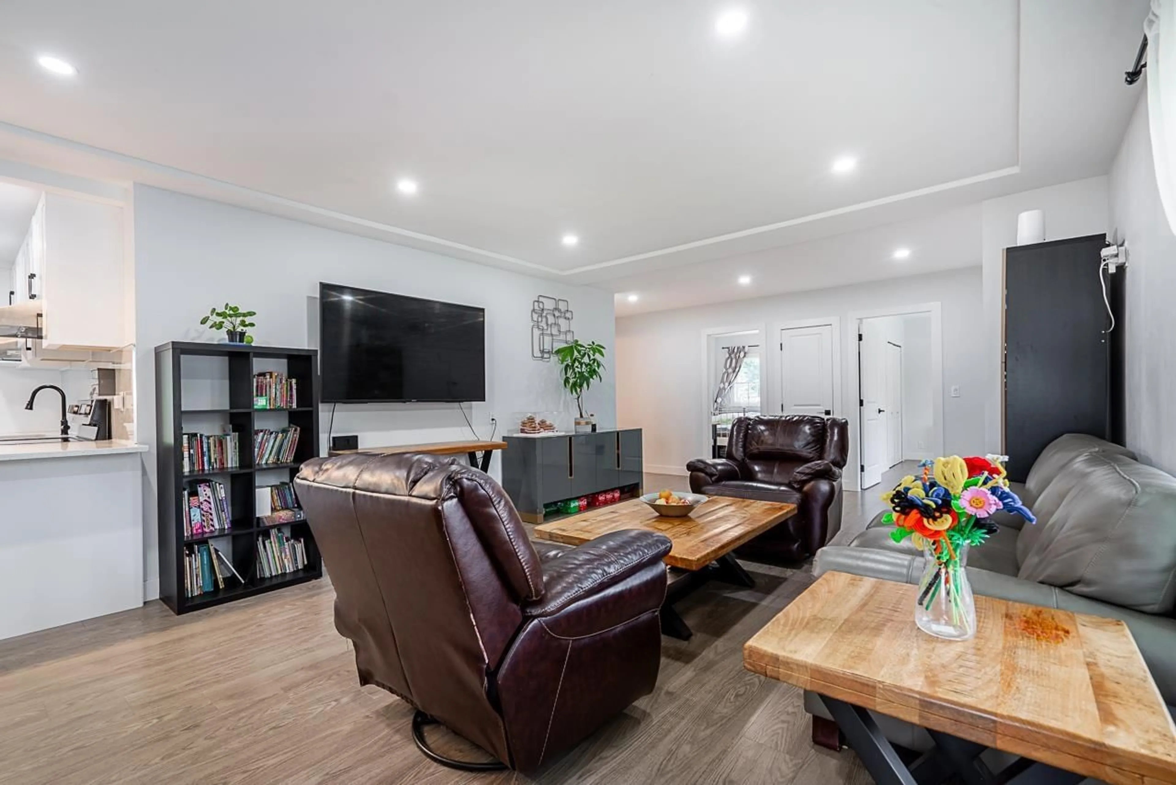 Living room with furniture, wood/laminate floor for 10875 143 STREET, Surrey British Columbia V3R3M1