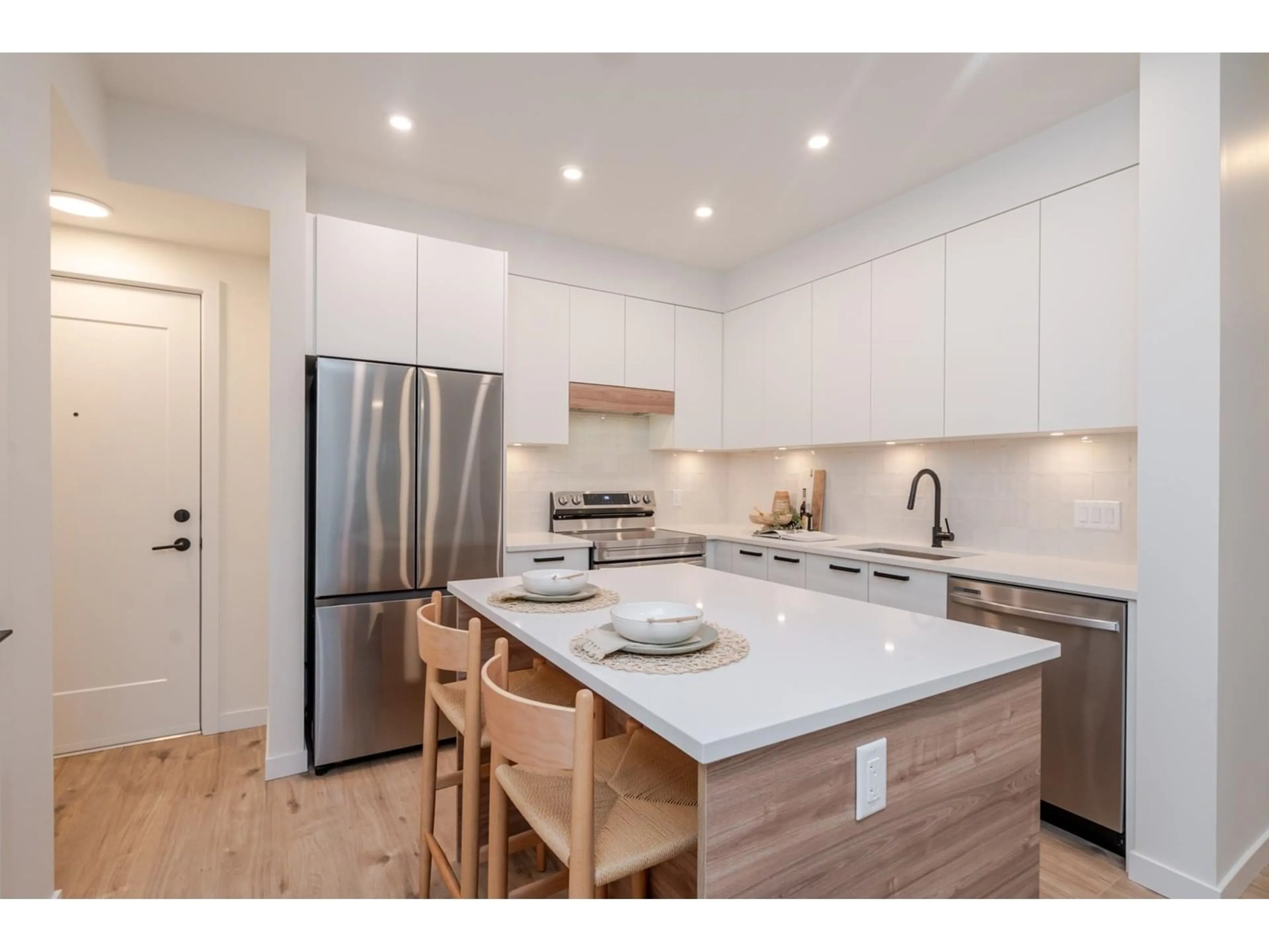 Open concept kitchen, wood/laminate floor for 202 - 33920 BEST, Mission British Columbia V2V7A4