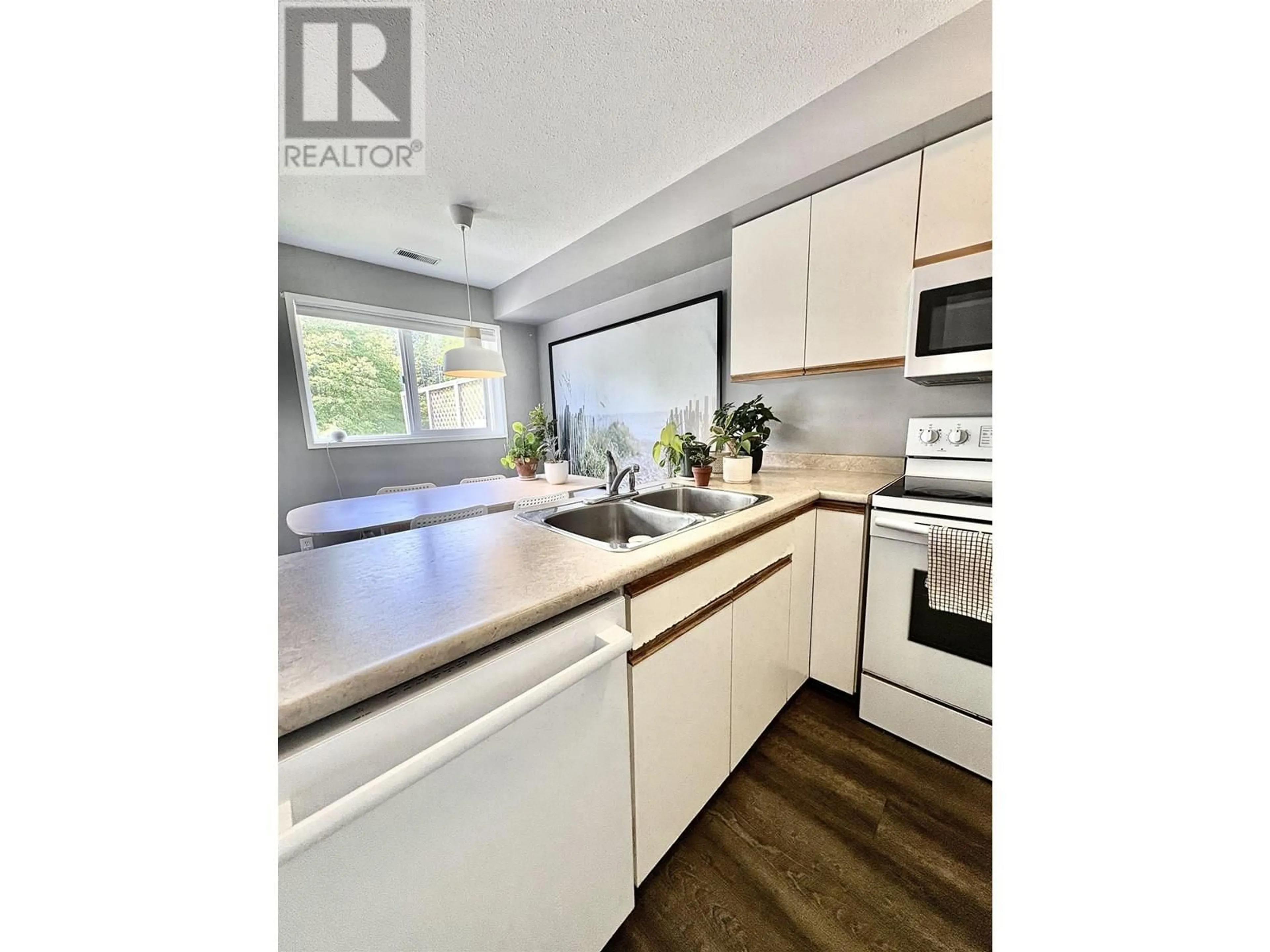 Open concept kitchen, wood/laminate floor for 2417 KALUM STREET, Terrace British Columbia V8G2M2