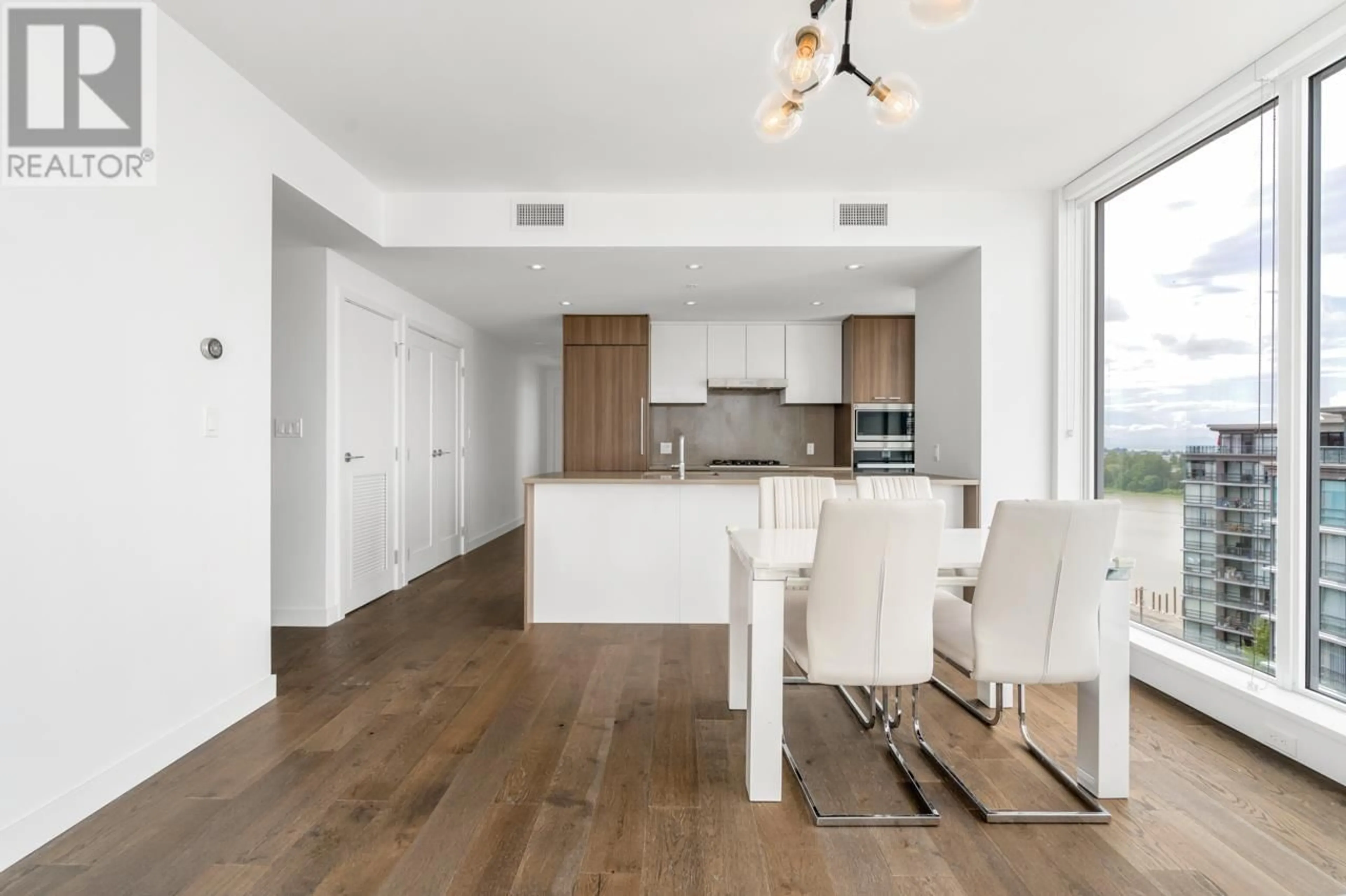 Open concept kitchen, wood/laminate floor for 1702 - 3200 CORVETTE WAY, Richmond British Columbia V6X0T8