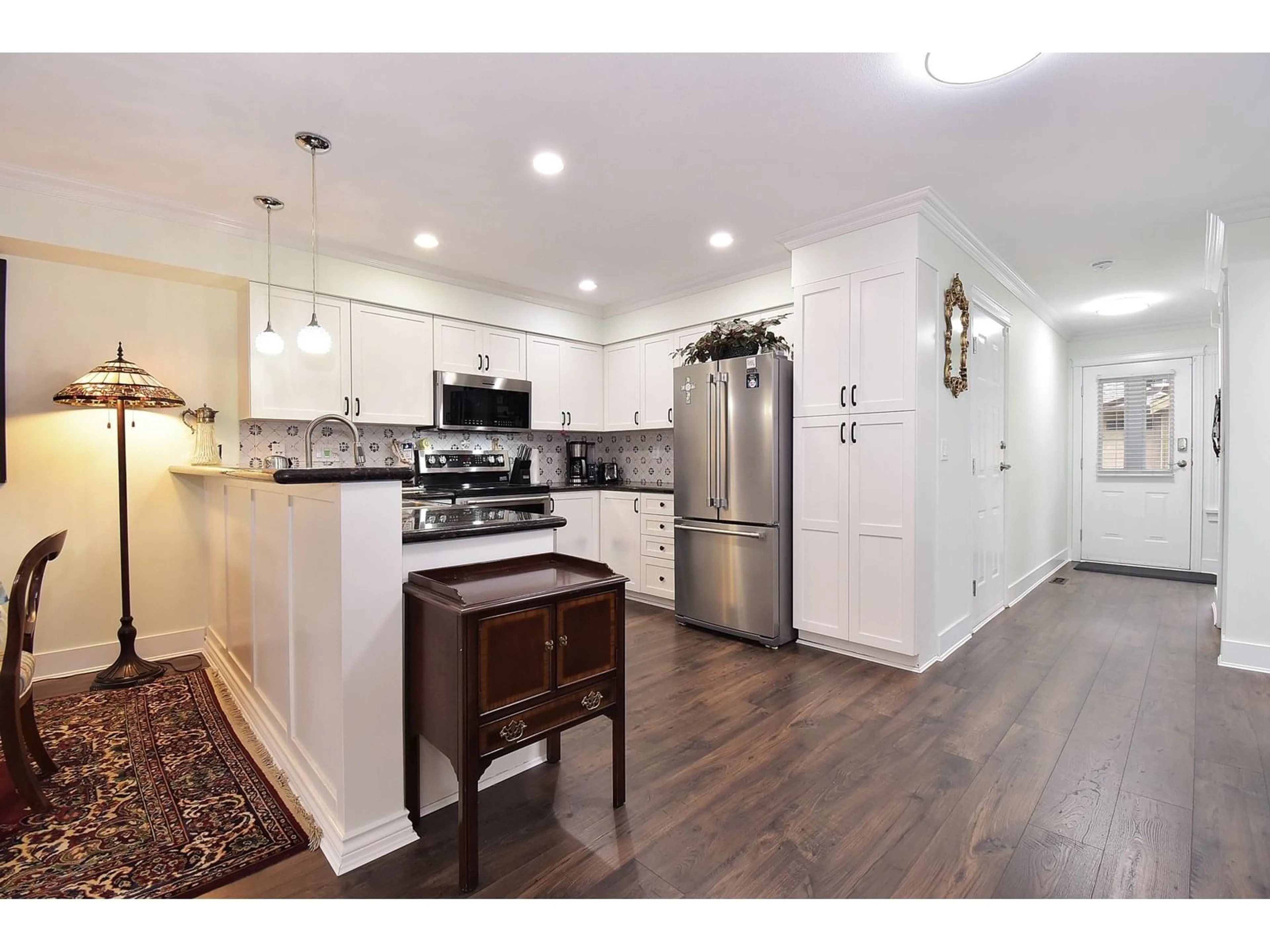 Open concept kitchen, wood/laminate floor for 131 - 12040 68, Surrey British Columbia V3W1P5