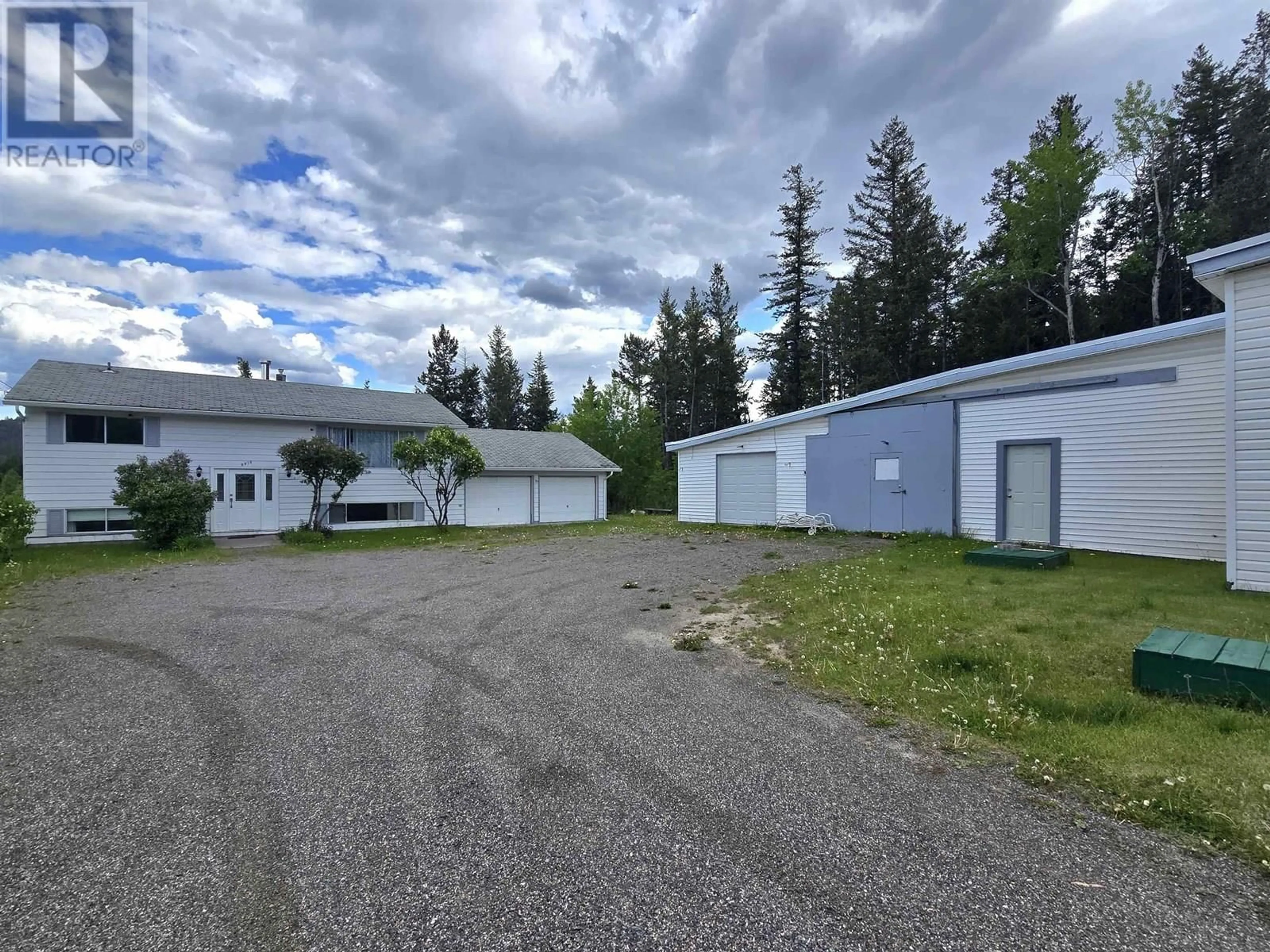 A pic from outside/outdoor area/front of a property/back of a property/a pic from drone, building for 997 ALDER AVENUE, 100 Mile House British Columbia V0K2E0
