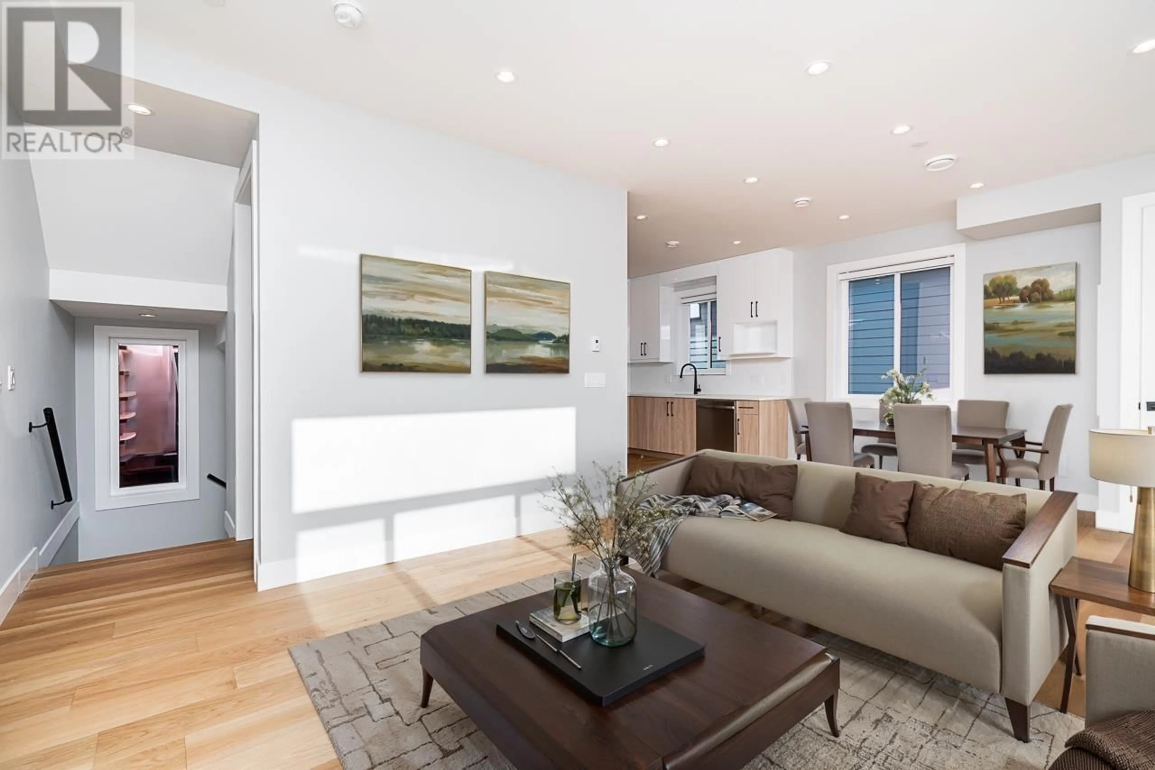 Living room with furniture, wood/laminate floor for 2705 DUNDAS STREET, Vancouver British Columbia V5K3L9