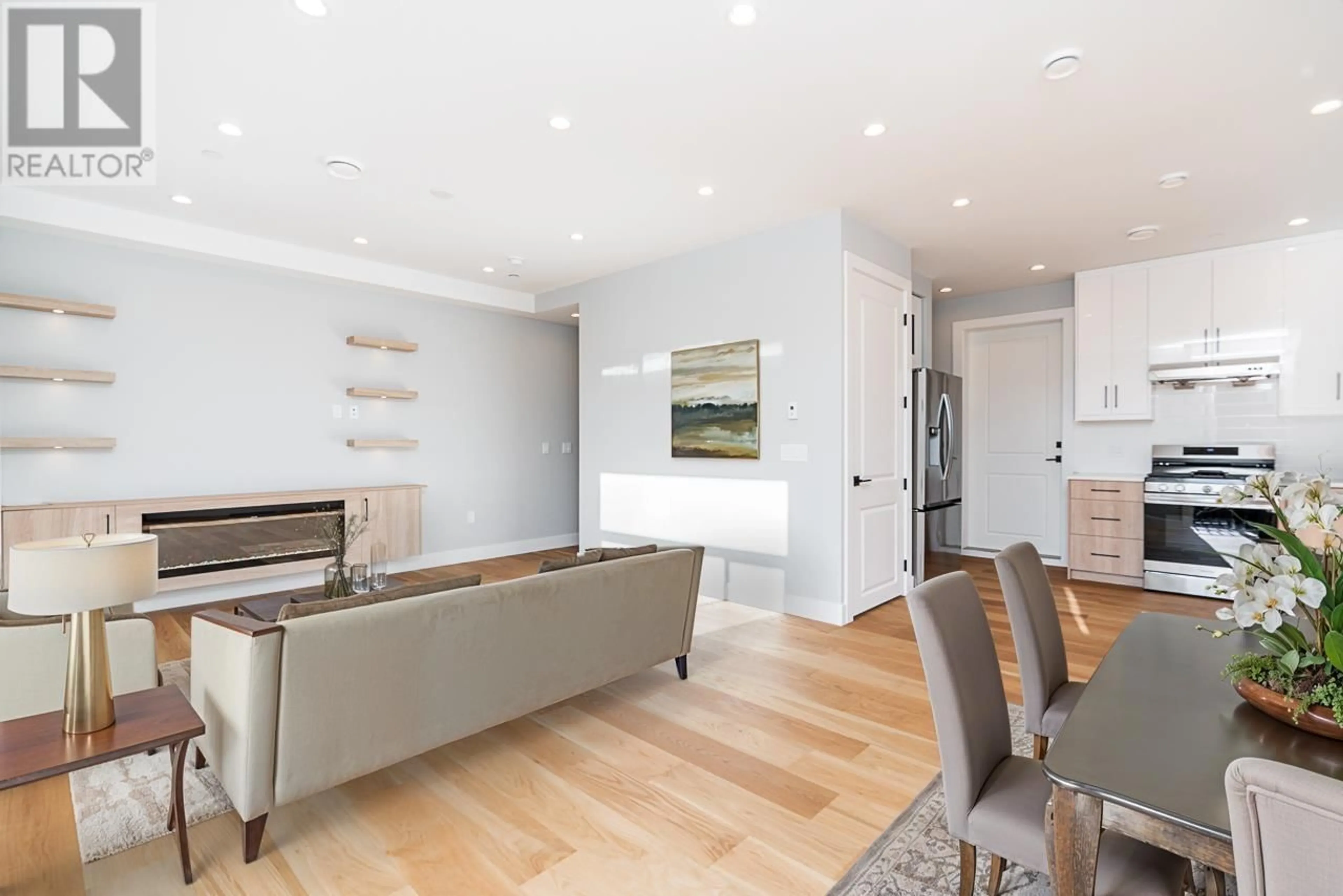 Living room with furniture, wood/laminate floor for 2705 DUNDAS STREET, Vancouver British Columbia V5K3L9