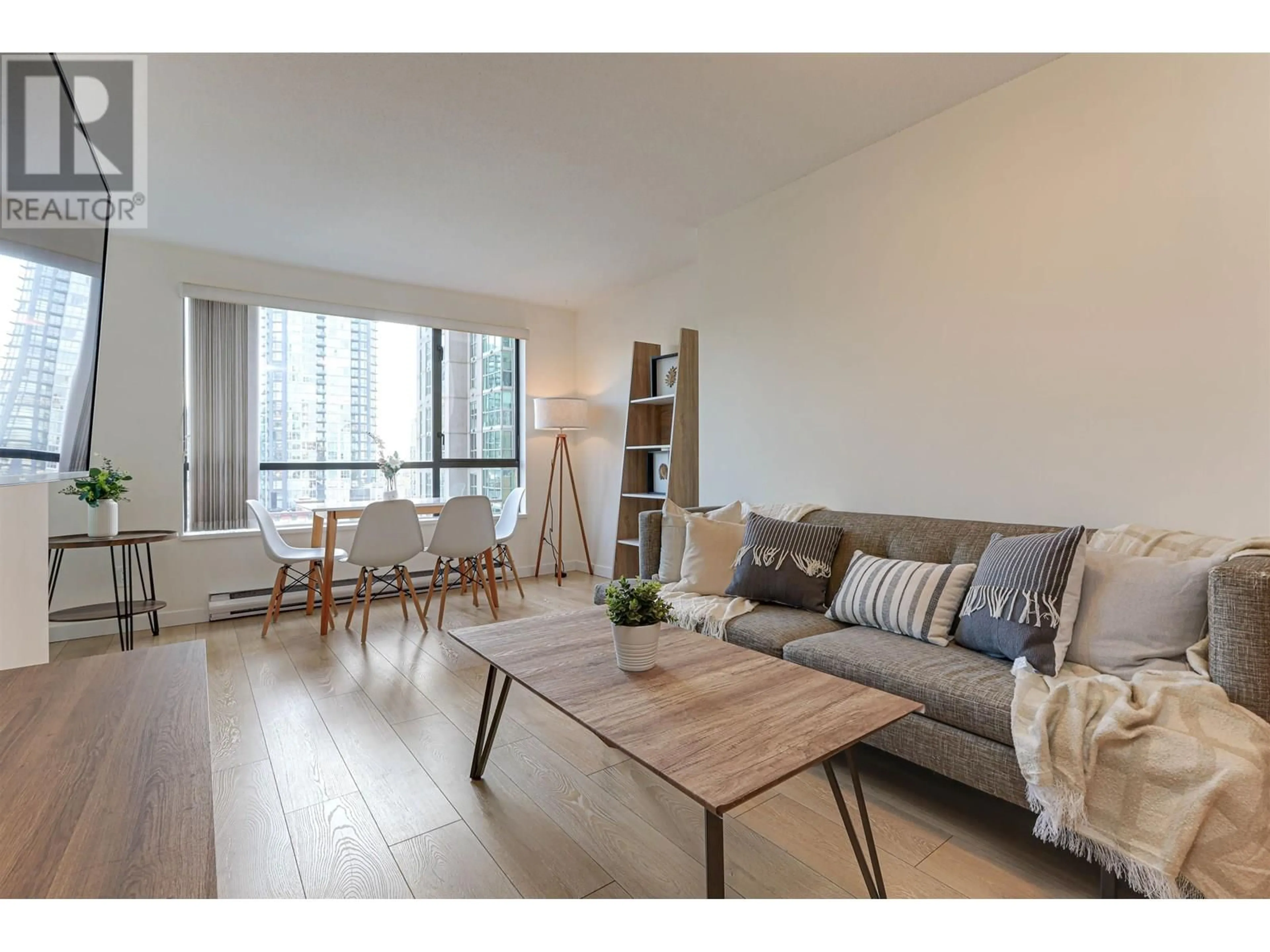 Living room with furniture, wood/laminate floor for 1105 - 1189 HOWE STREET, Vancouver British Columbia V6Z2X4