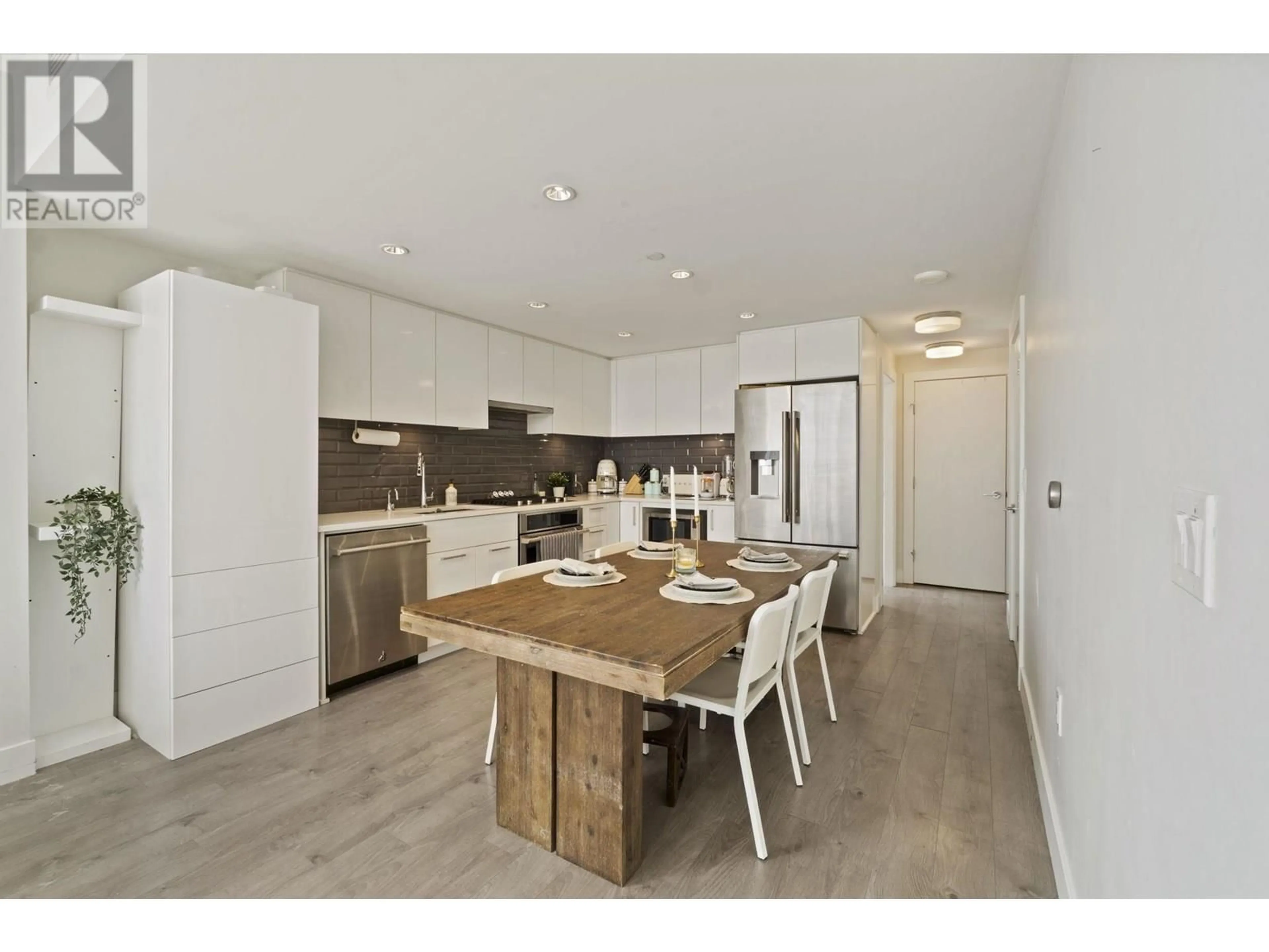 Open concept kitchen, wood/laminate floor for 506 - 3451 SAWMILL CRESCENT, Vancouver British Columbia V5S0H3
