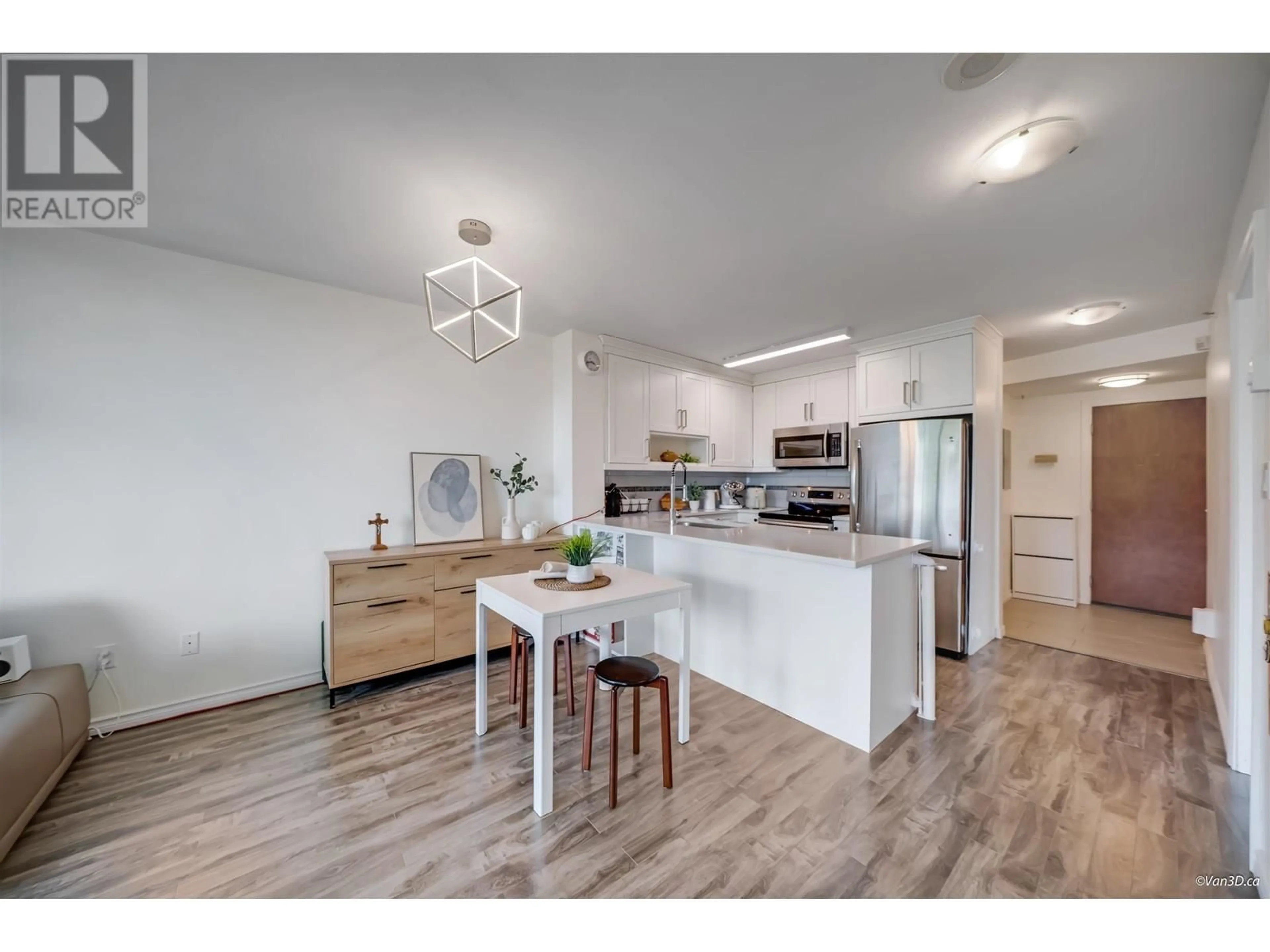 Open concept kitchen, wood/laminate floor for 1008 - 2733 CHANDLERY PLACE, Vancouver British Columbia V5S4V3