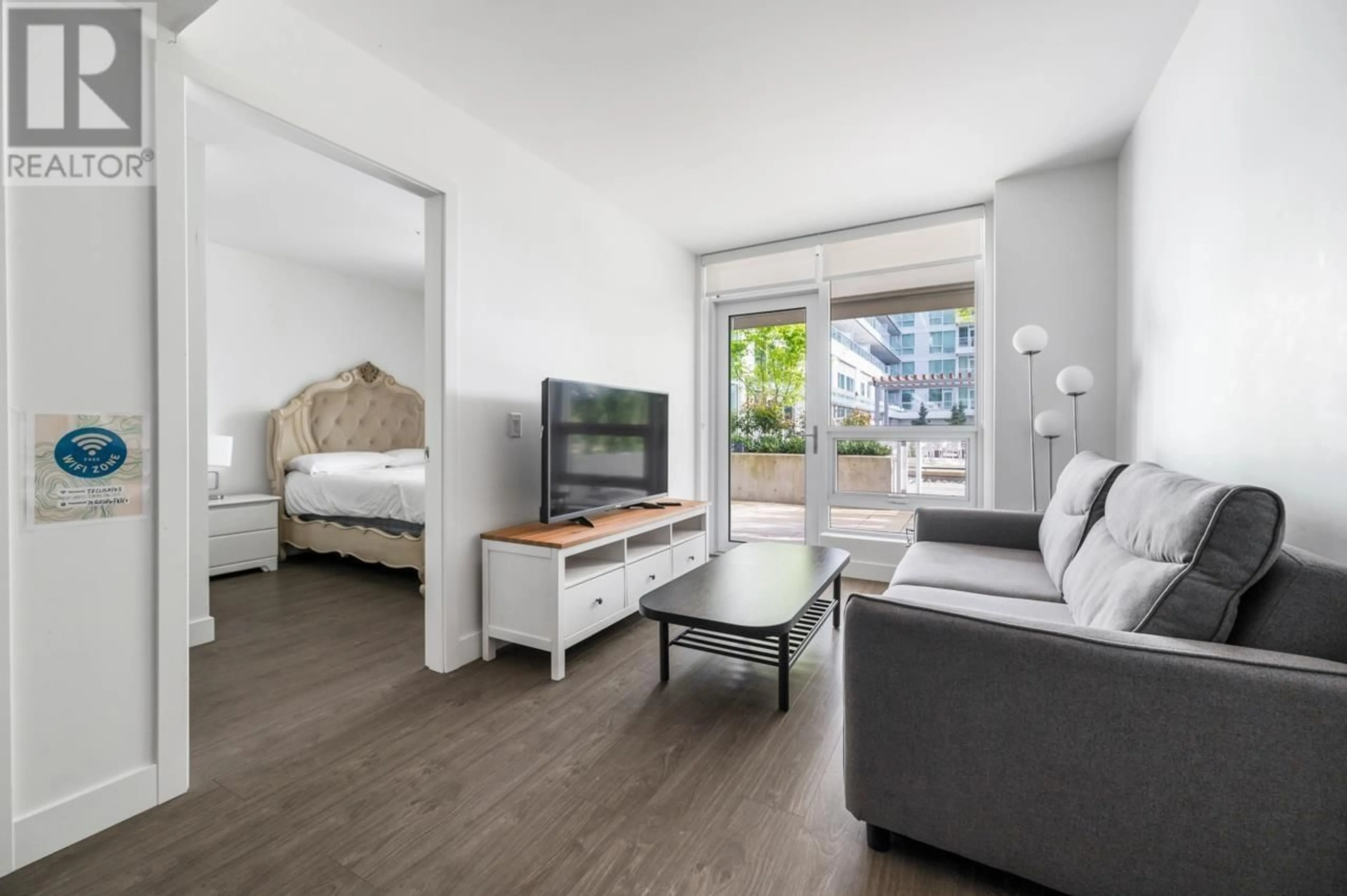 Living room with furniture, wood/laminate floor for 320 - 6328 NO. 3 ROAD, Richmond British Columbia V6Y0L6