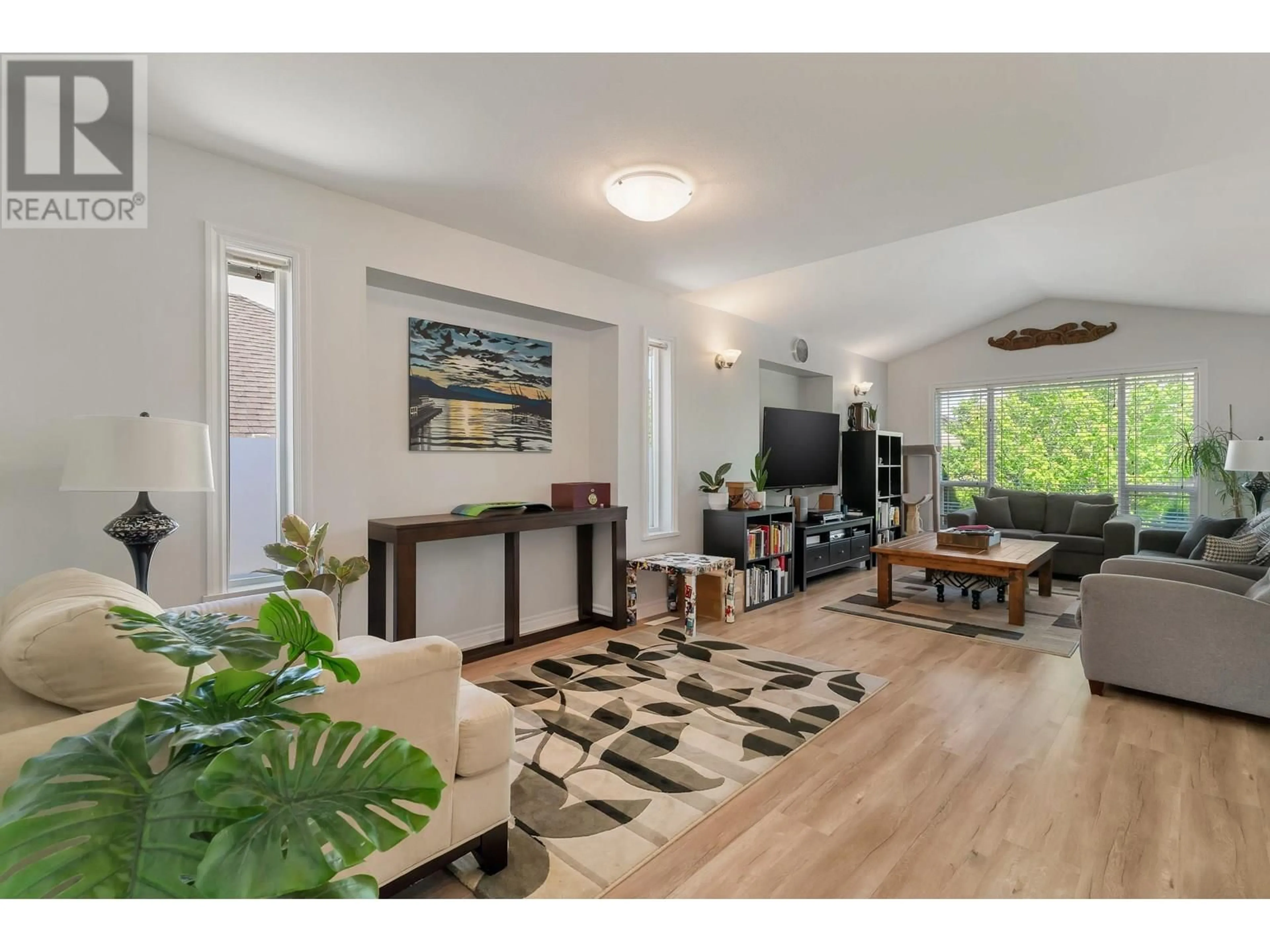 Living room with furniture, wood/laminate floor for 23788 KANAKA WAY, Maple Ridge British Columbia V2W1E5