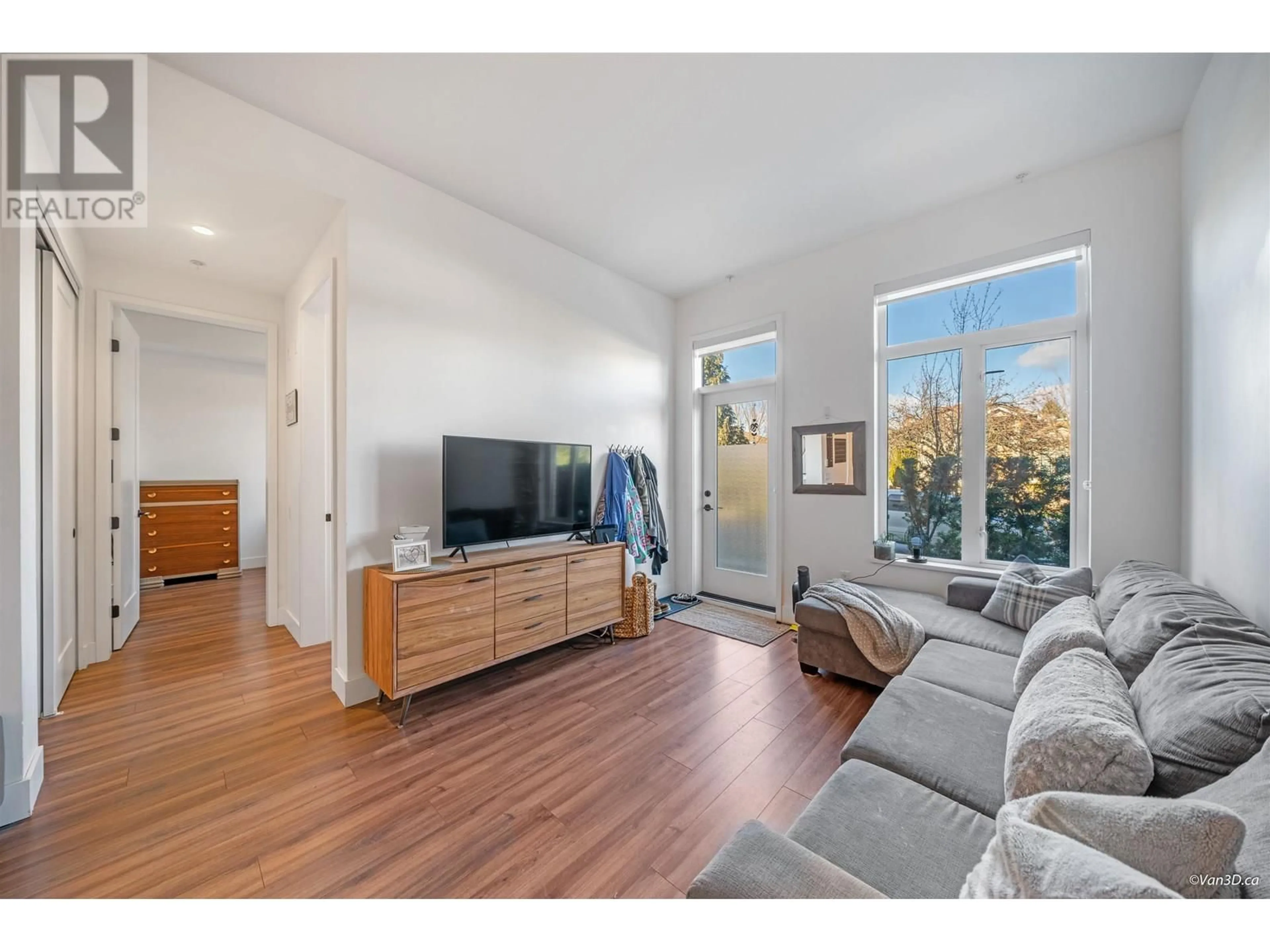 Living room with furniture, wood/laminate floor for 109 - 288 KING EDWARD AVENUE, Vancouver British Columbia V5Y2J2