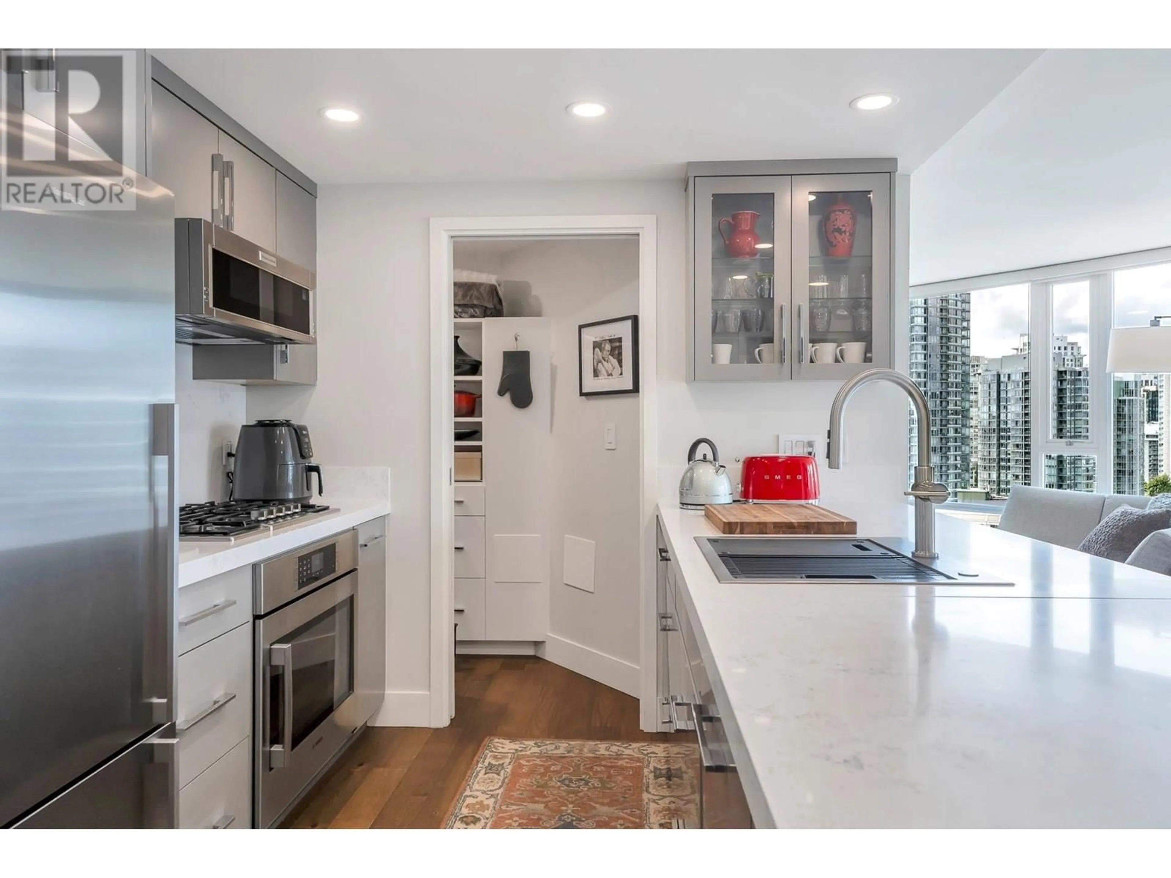 Open concept kitchen, ceramic/tile floor for 2007 - 918 COOPERAGE MEWS, Vancouver British Columbia V6B0A7