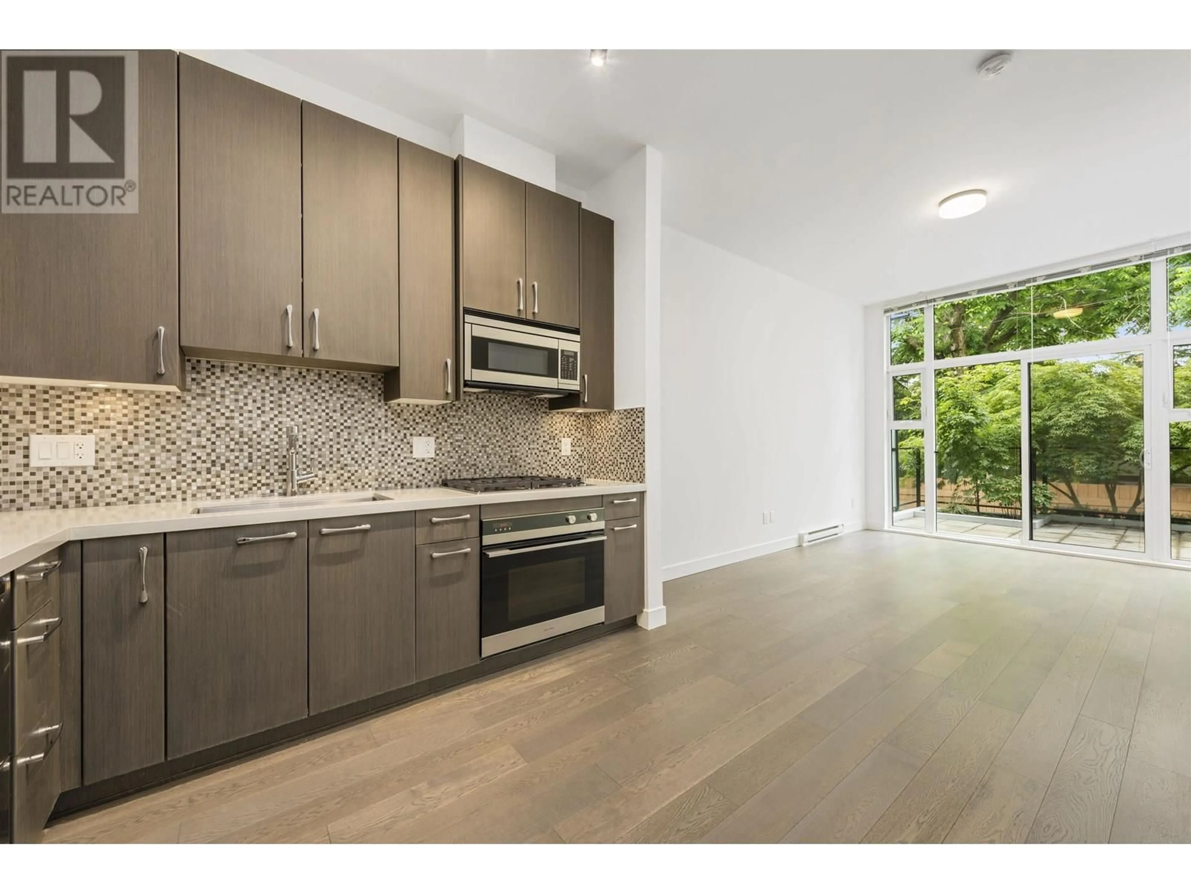 Open concept kitchen, ceramic/tile floor for 101 - 5325 BOULEVARD, Vancouver British Columbia V6M3W4