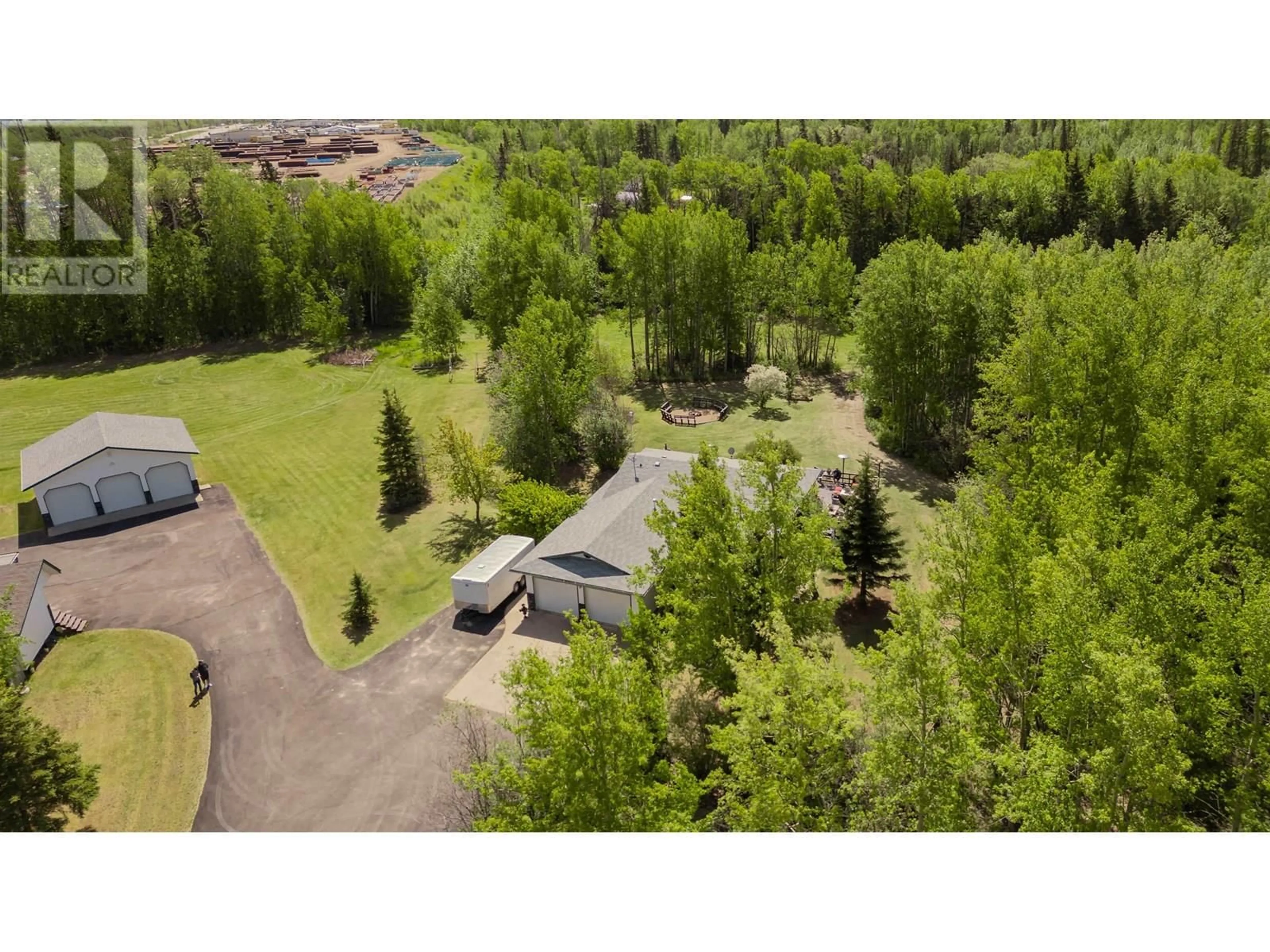 A pic from outside/outdoor area/front of a property/back of a property/a pic from drone, forest/trees view for 13514 ROBIN ROAD, Charlie Lake British Columbia V0C1H0