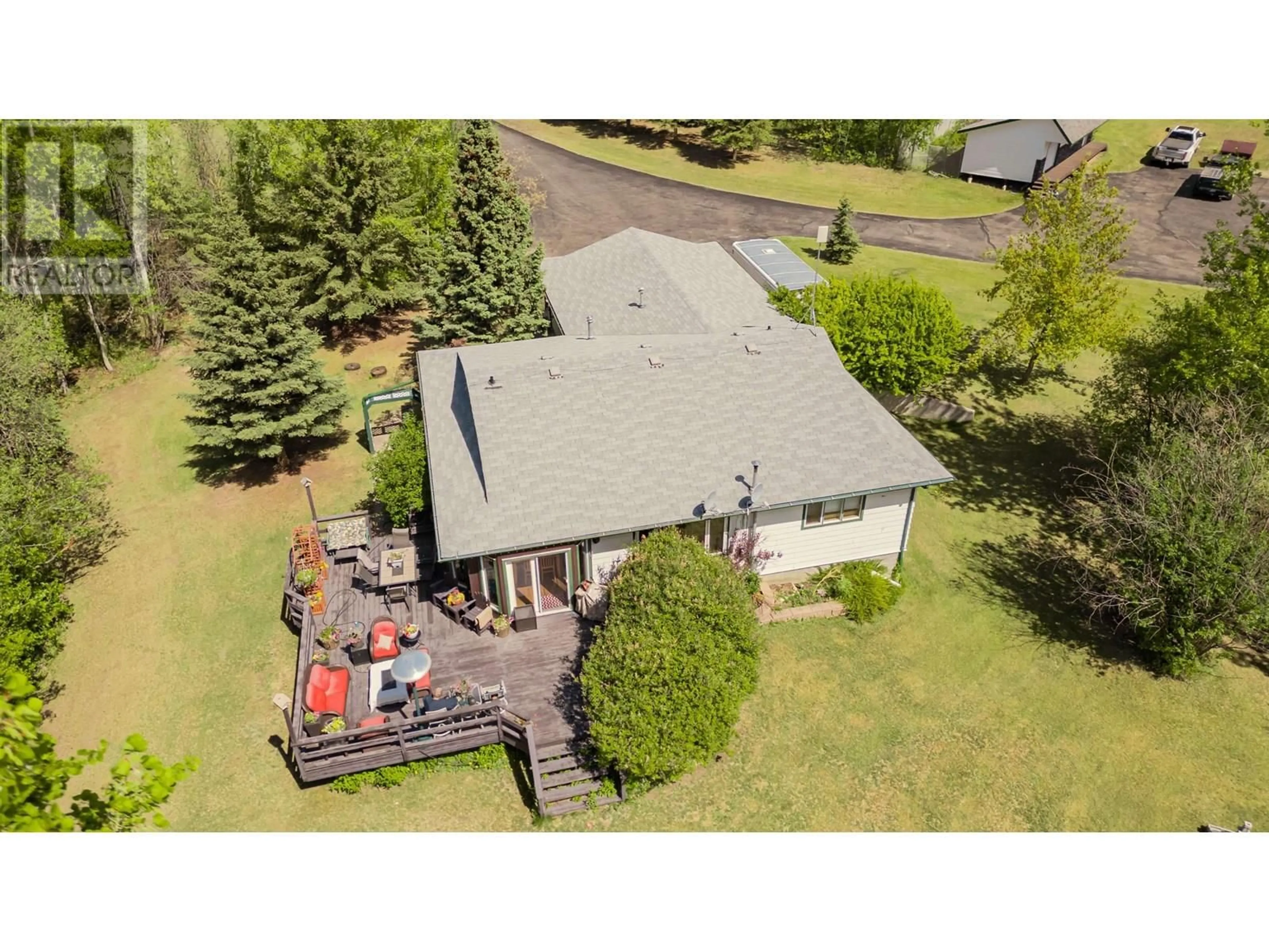 A pic from outside/outdoor area/front of a property/back of a property/a pic from drone, unknown for 13514 ROBIN ROAD, Charlie Lake British Columbia V0C1H0