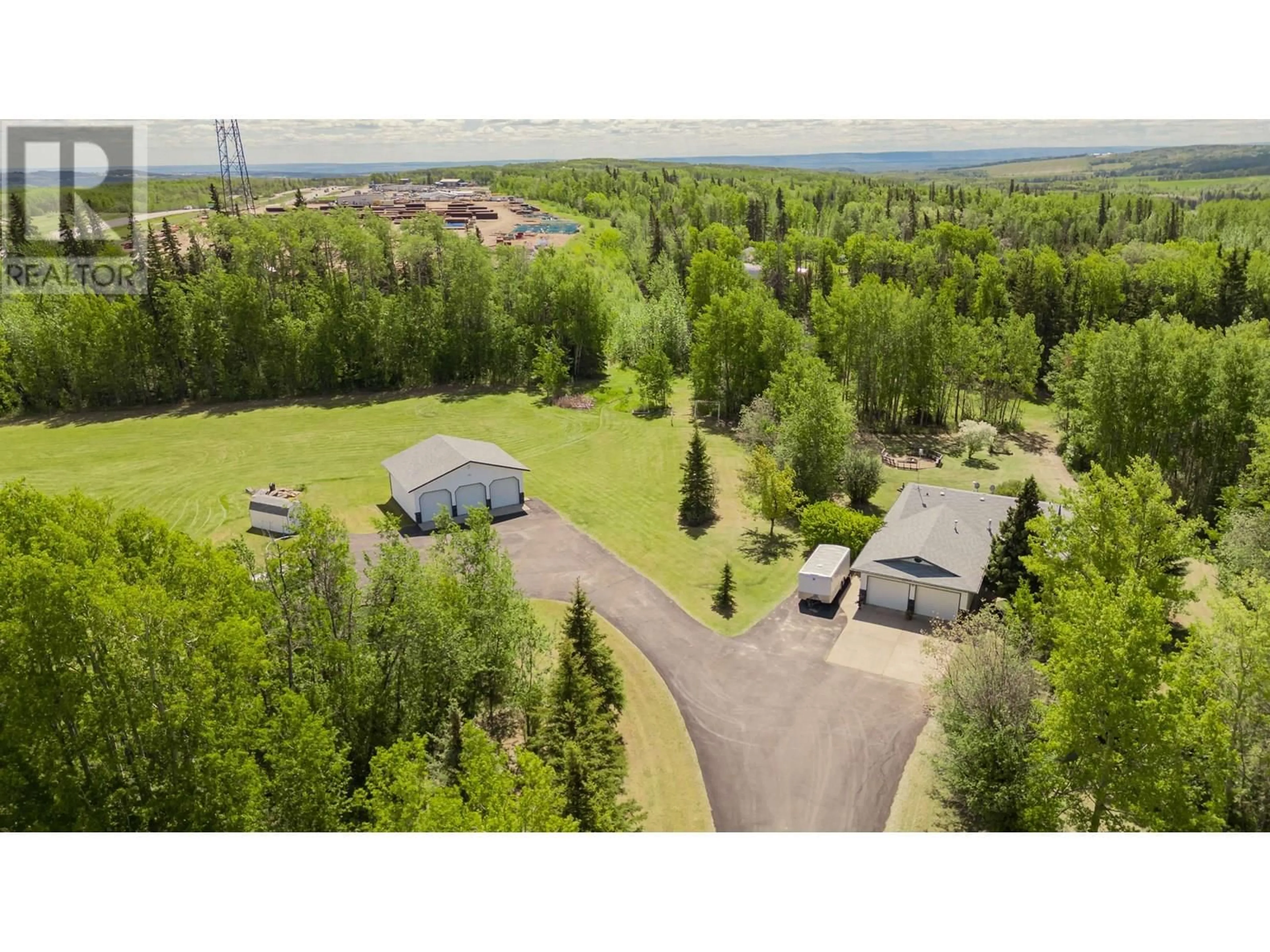 A pic from outside/outdoor area/front of a property/back of a property/a pic from drone, forest/trees view for 13514 ROBIN ROAD, Charlie Lake British Columbia V0C1H0