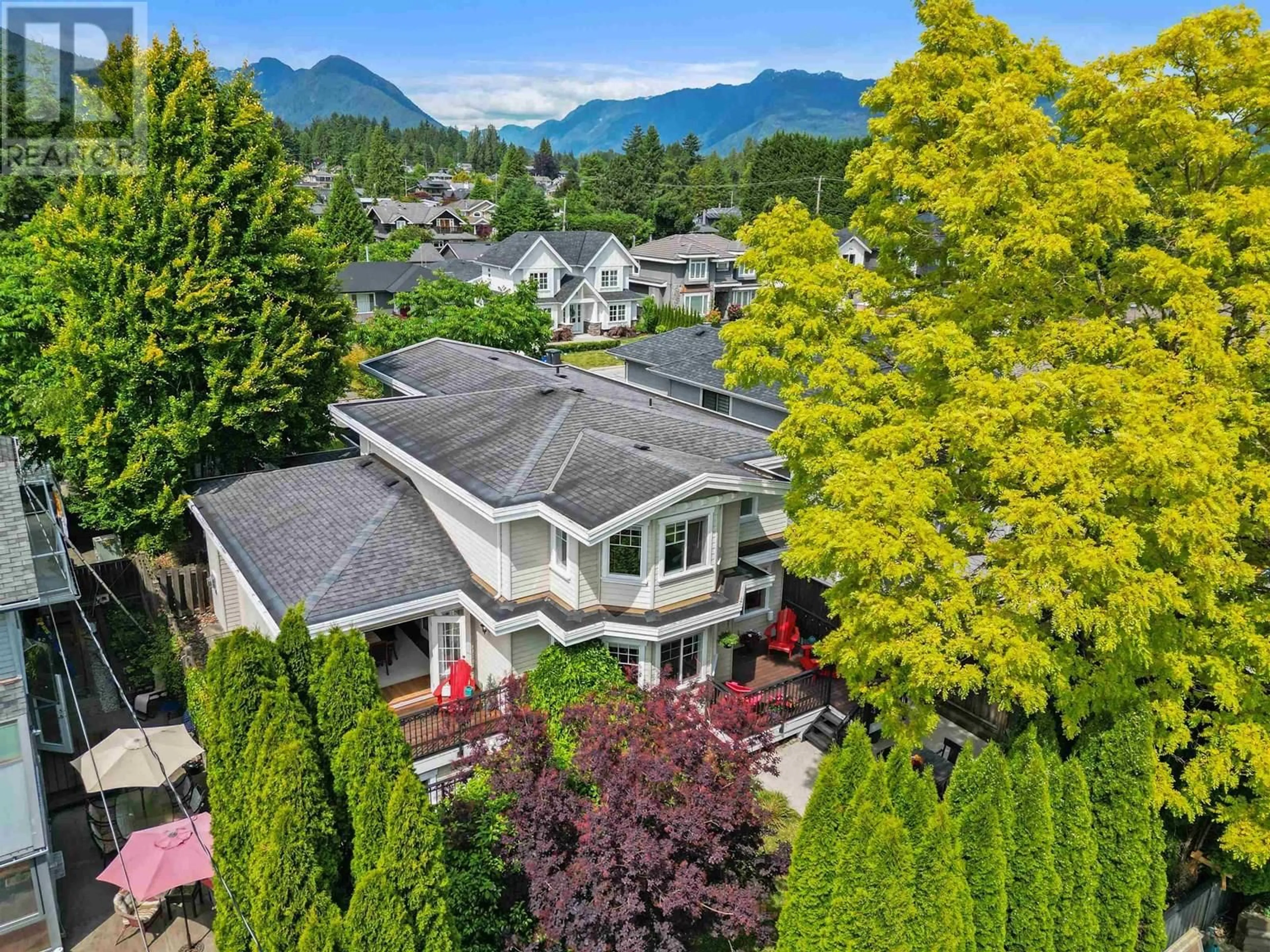 A pic from outside/outdoor area/front of a property/back of a property/a pic from drone, mountain view for 749 10TH STREET, North Vancouver British Columbia V7L2G2
