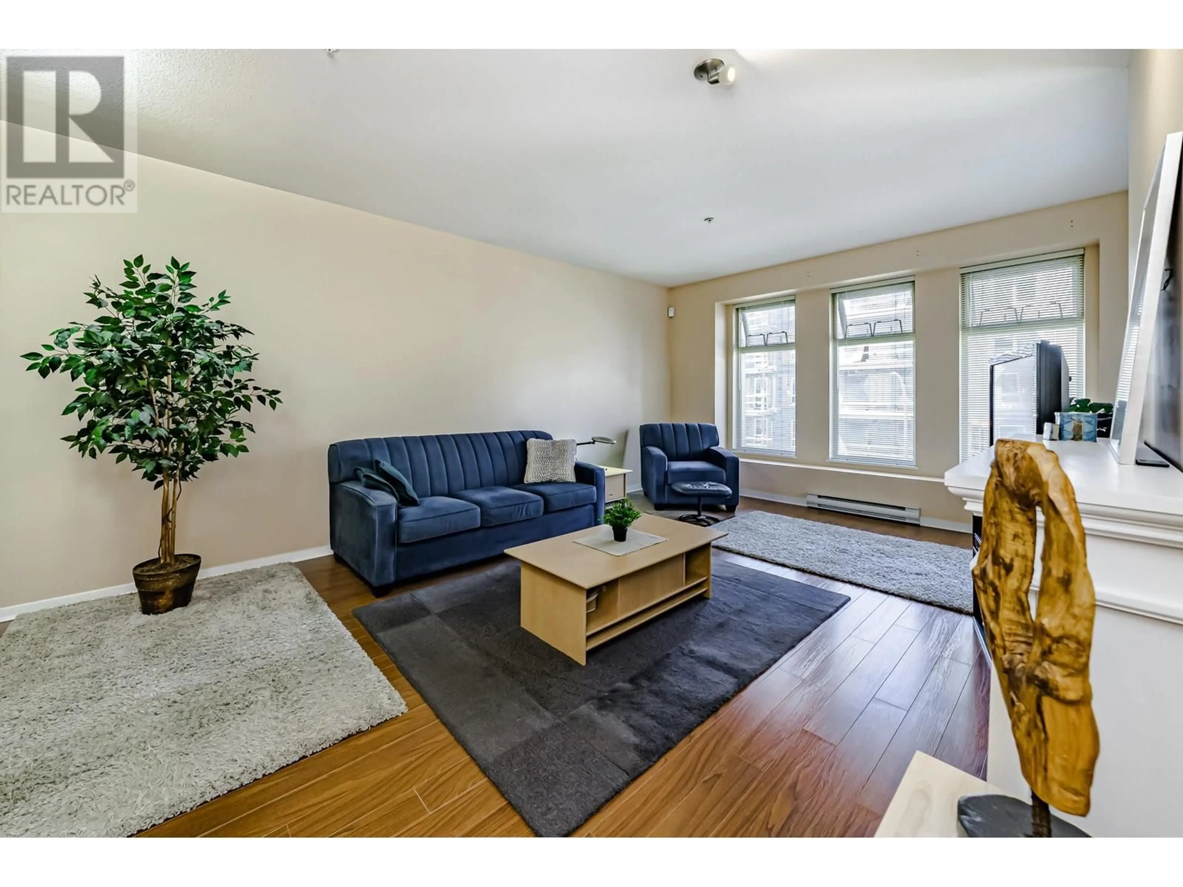 Living room with furniture, wood/laminate floor for 305 - 2488 WELCHER AVENUE, Port Coquitlam British Columbia V3C1X7