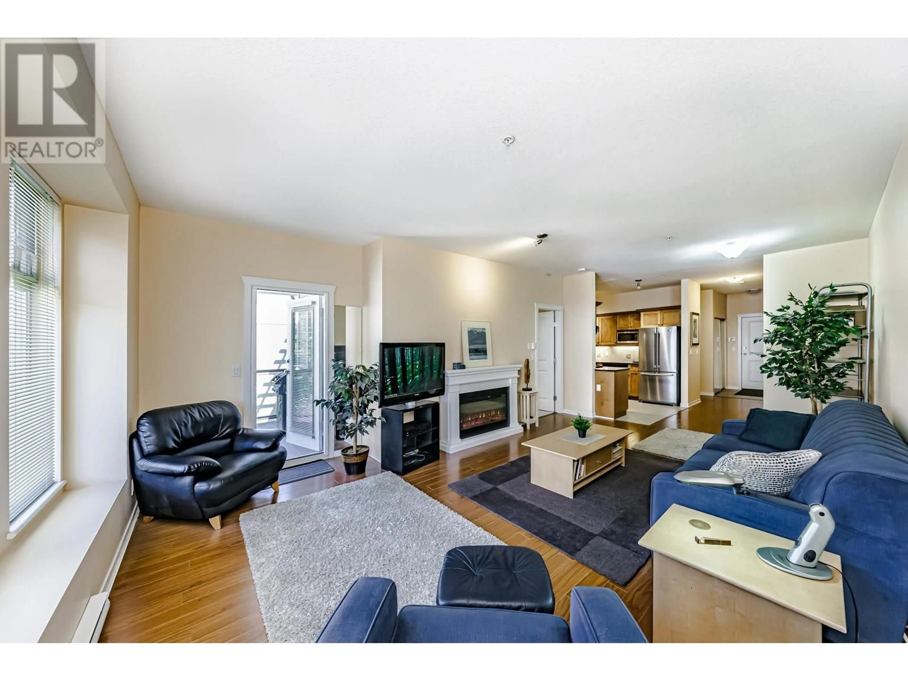 Living room with furniture, wood/laminate floor for 305 - 2488 WELCHER AVENUE, Port Coquitlam British Columbia V3C1X7