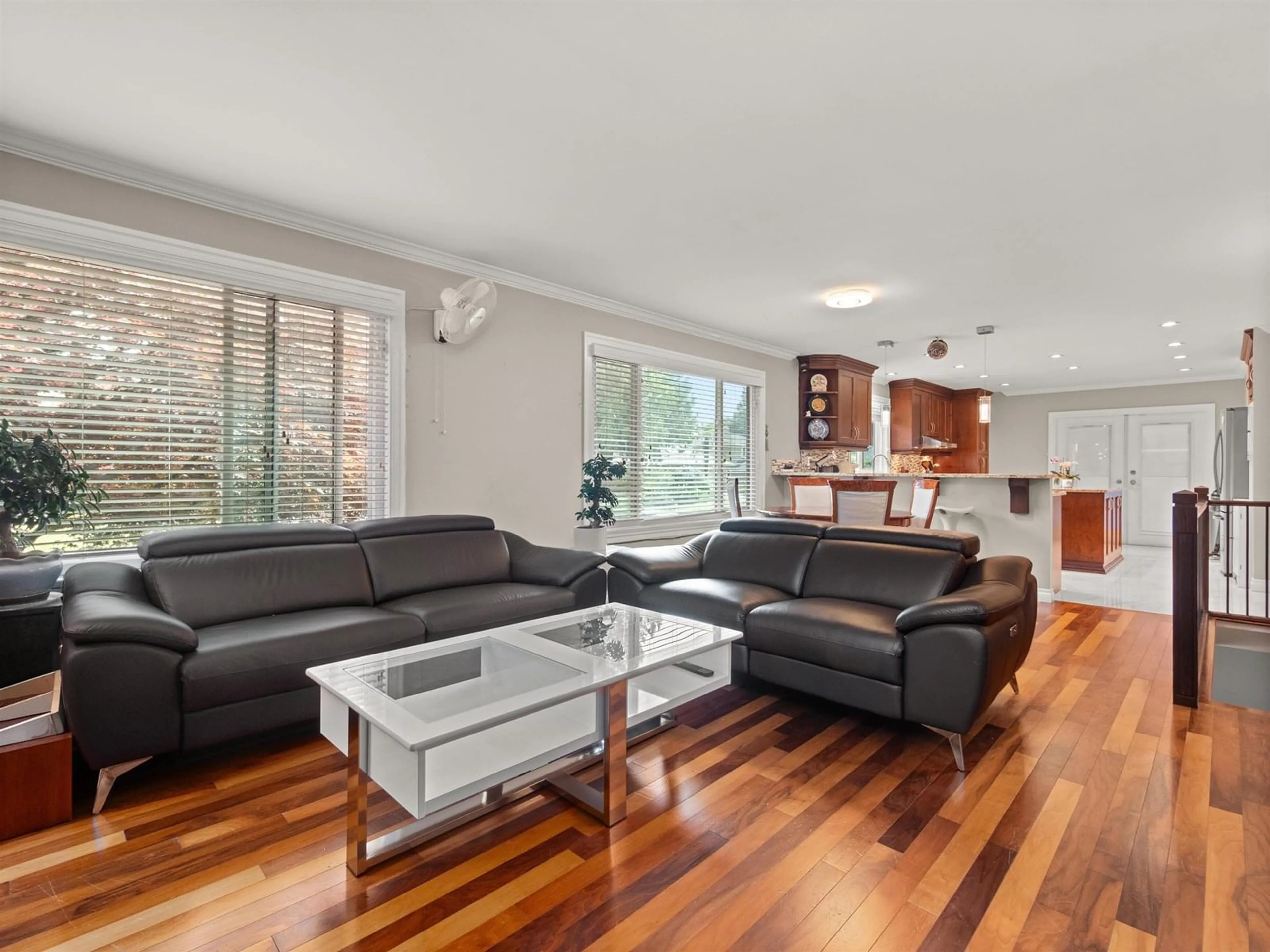 Living room with furniture, wood/laminate floor for 10733 DUNLOP, Delta British Columbia V4C2M7