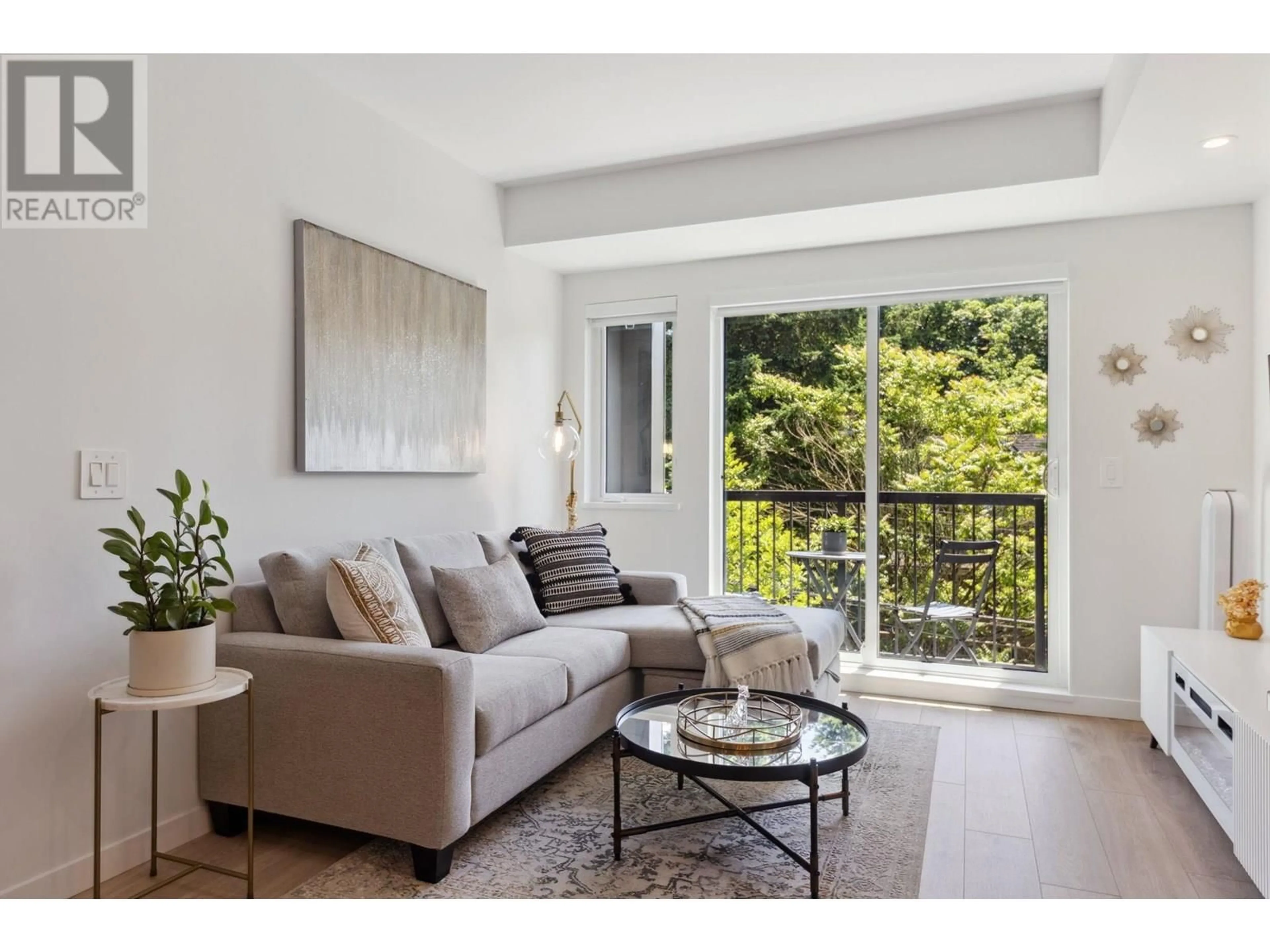 Living room with furniture, wood/laminate floor for 316 - 2520 GUELPH STREET, Vancouver British Columbia V5T0K7