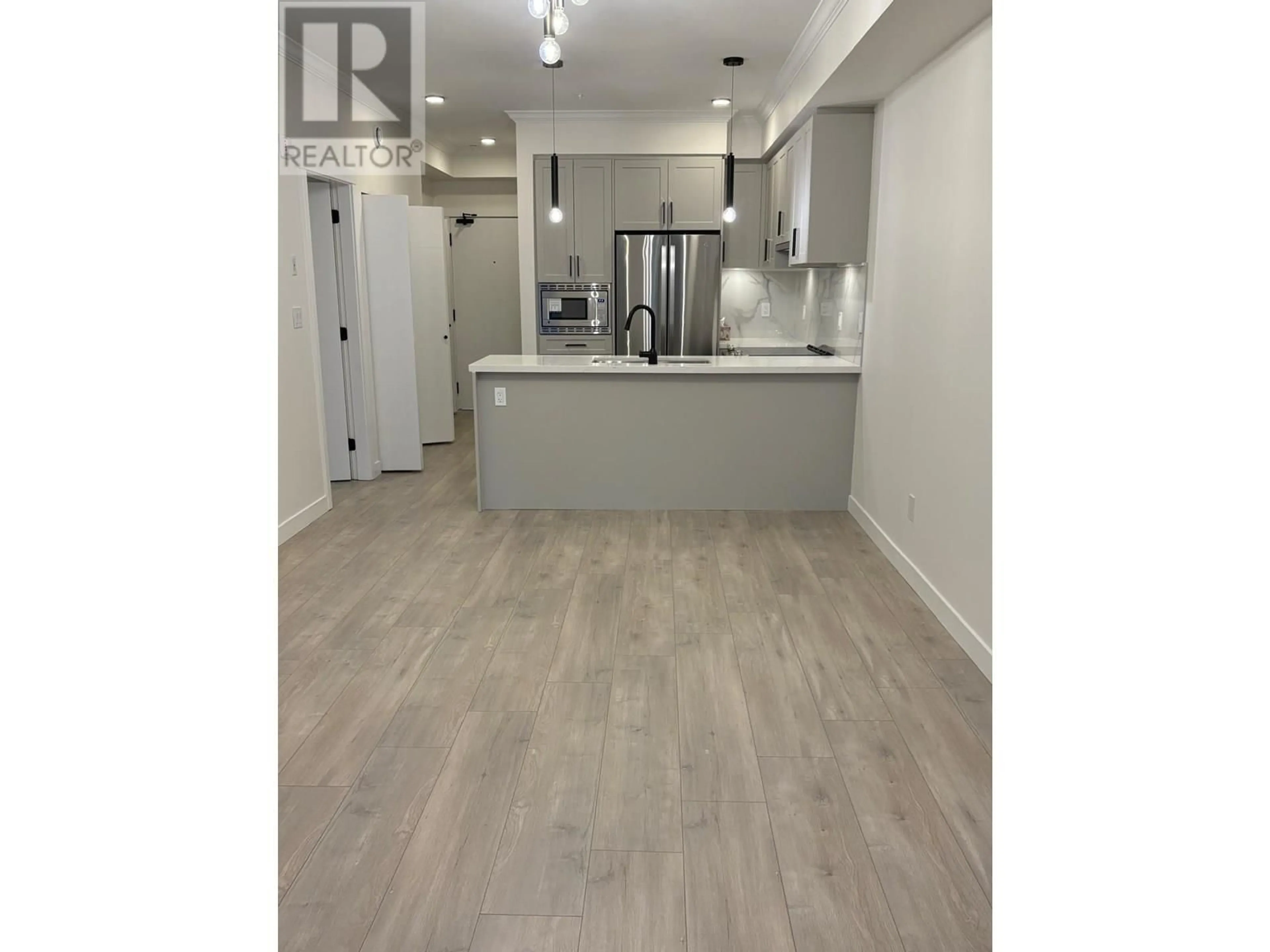 Open concept kitchen, wood/laminate floor for 208 - 12109 223 STREET, Maple Ridge British Columbia V2X5Y6
