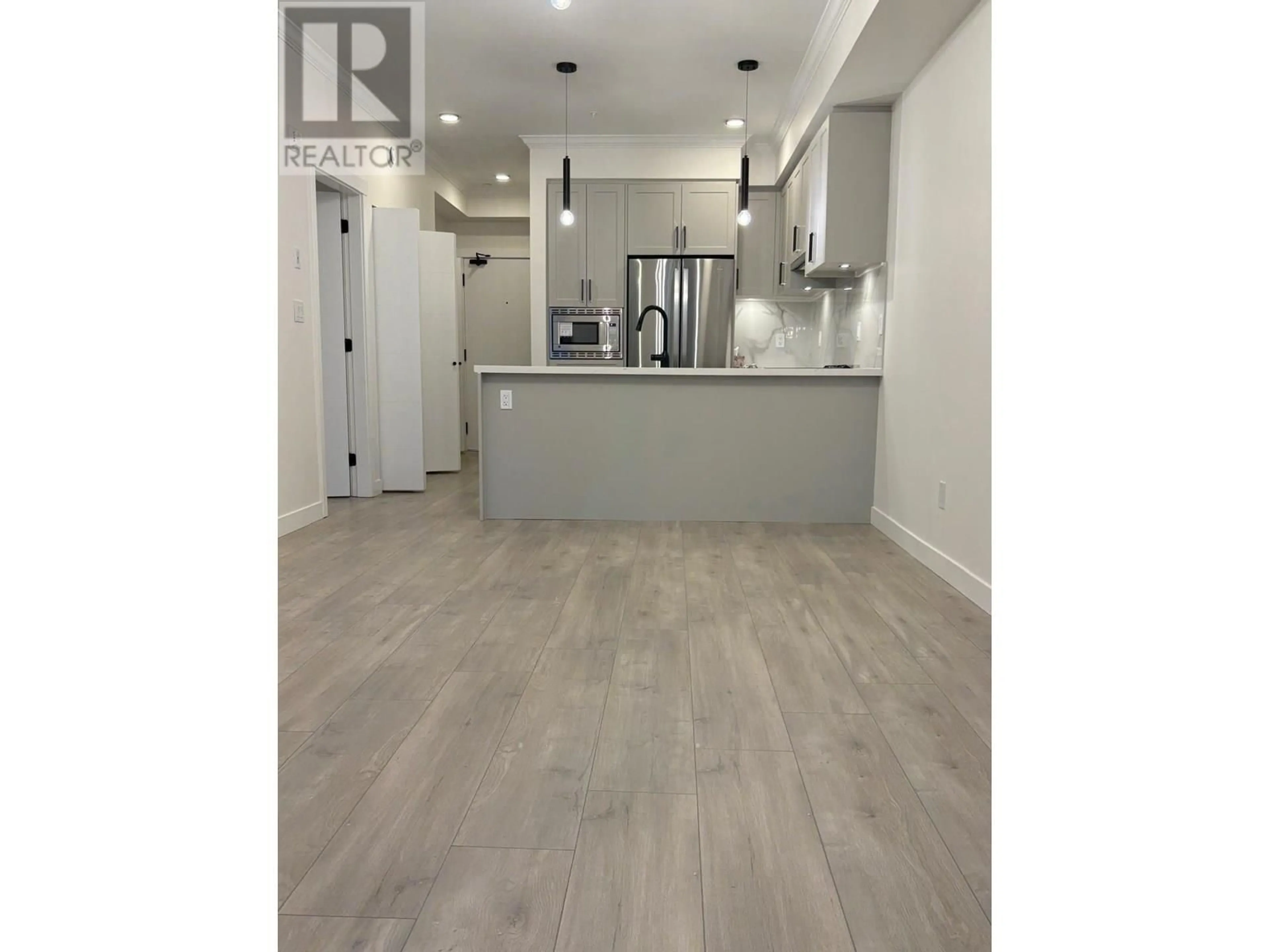 Open concept kitchen, wood/laminate floor for 208 - 12109 223 STREET, Maple Ridge British Columbia V2X5Y6