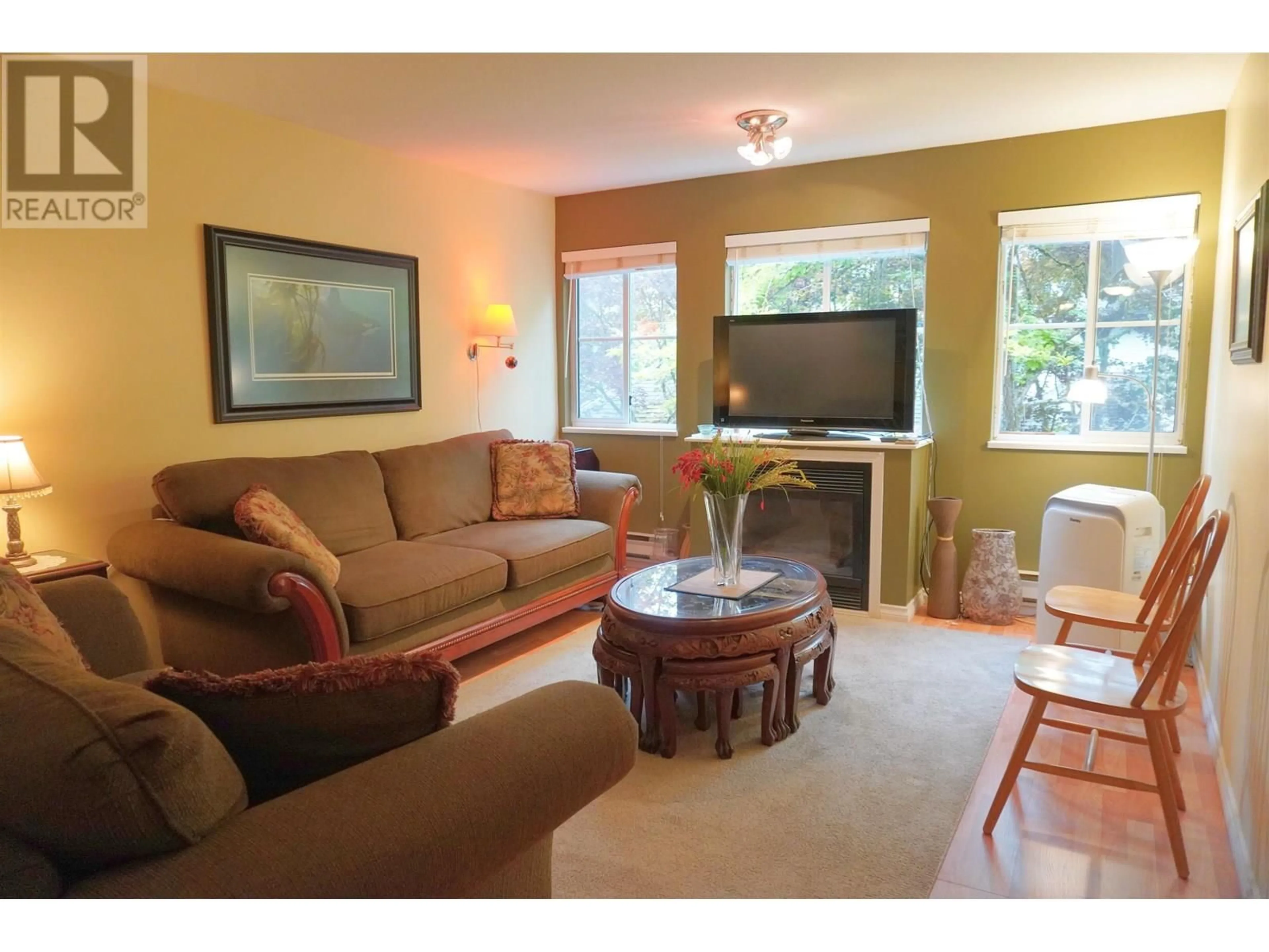 Living room with furniture, wood/laminate floor for 19 - 19034 MCMYN ROAD, Pitt Meadows British Columbia V3Y2N8