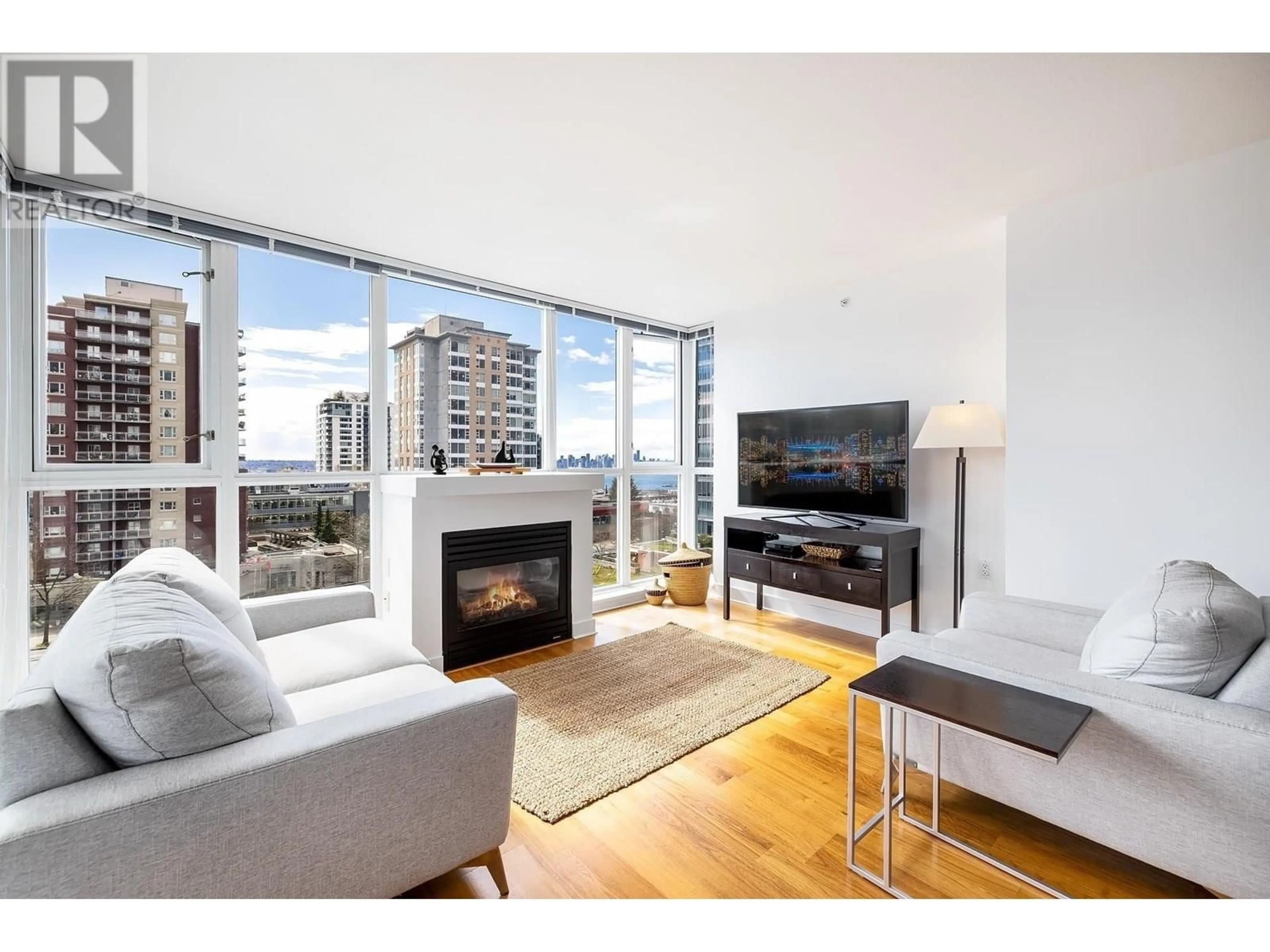 Living room with furniture, wood/laminate floor for 701 - 121 16TH STREET, North Vancouver British Columbia V7M1T3