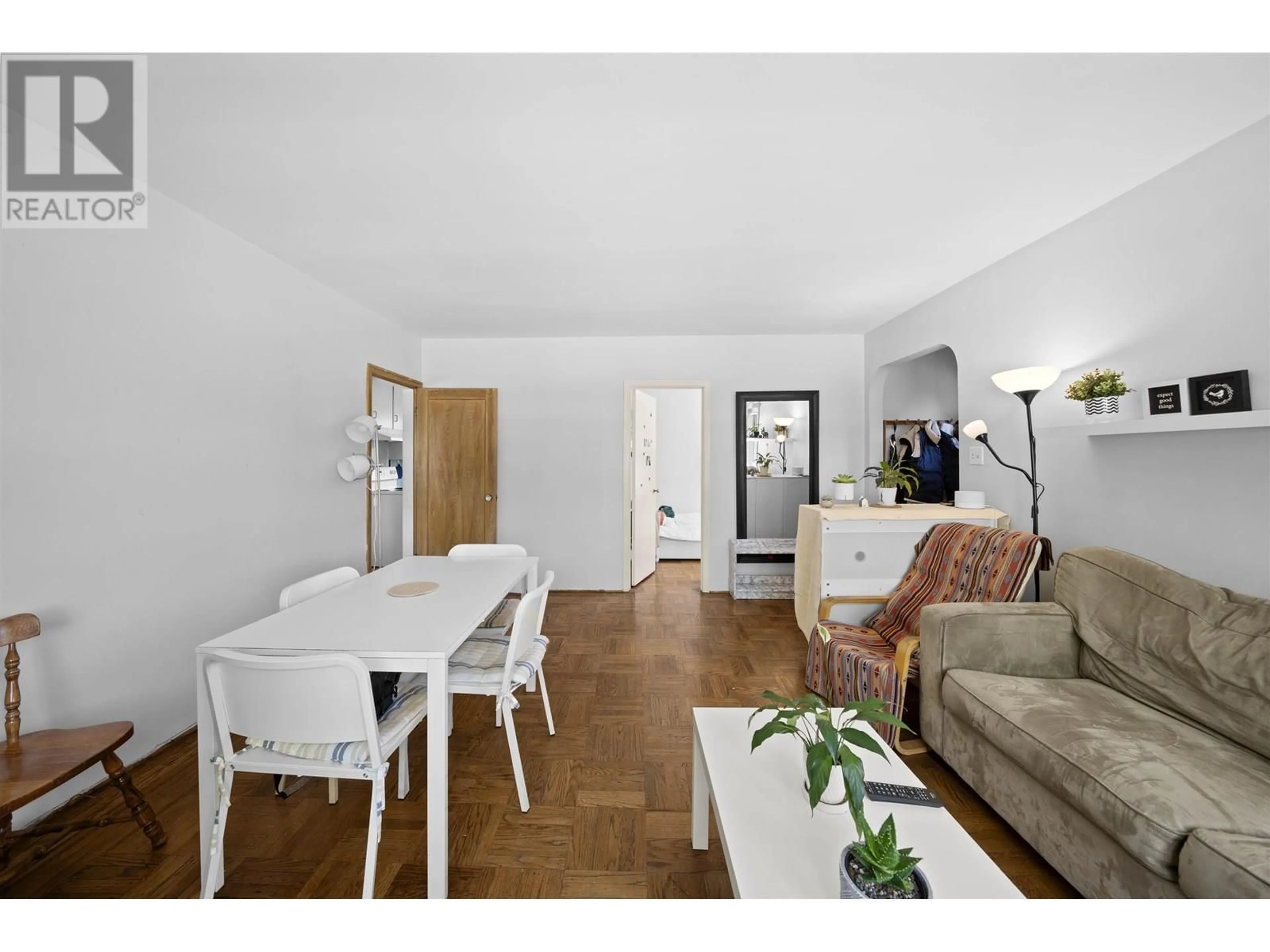 Living room with furniture, wood/laminate floor for 8594 FREMLIN STREET, Vancouver British Columbia V6P3X2