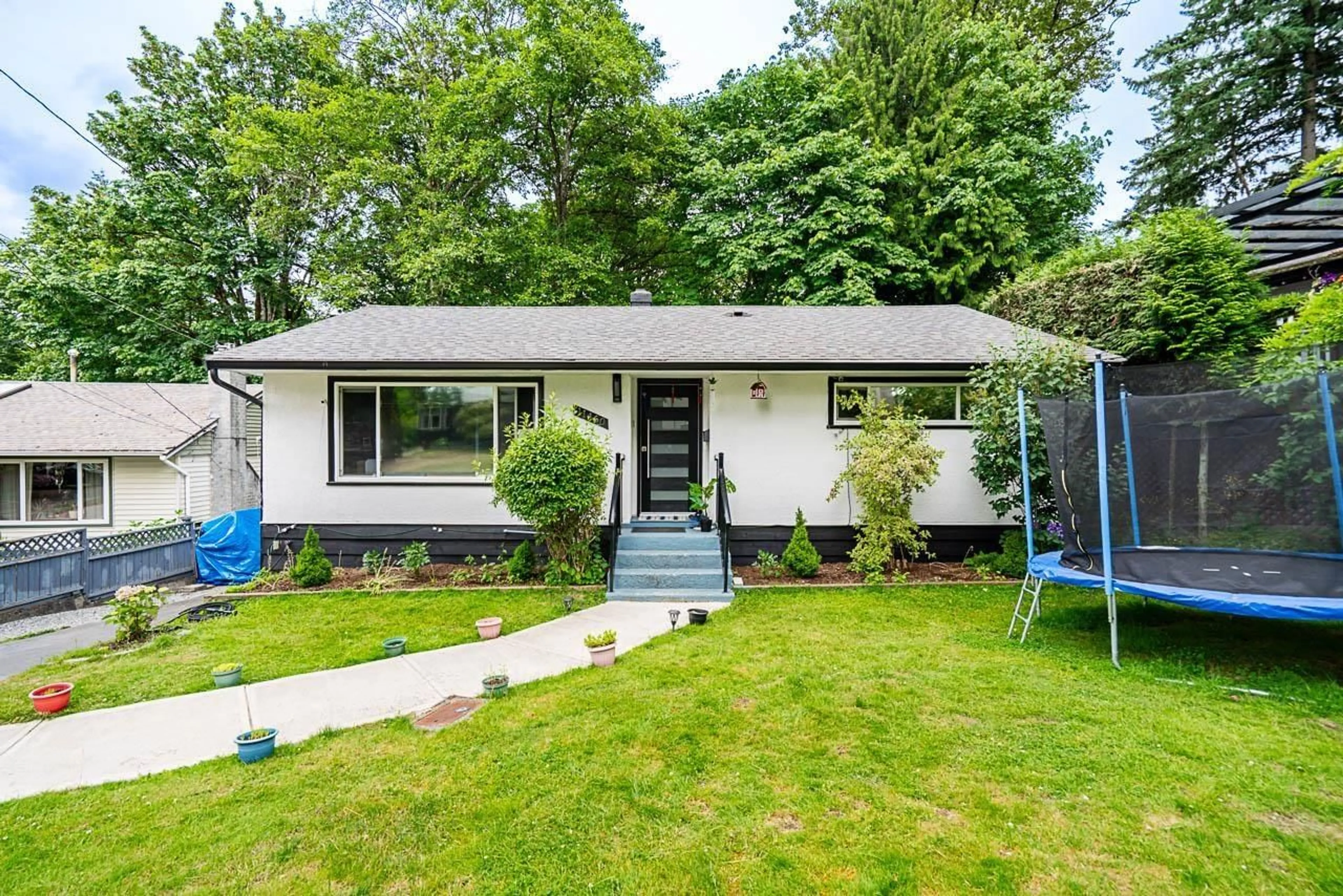 Home with vinyl exterior material, street for 11460 141A, Surrey British Columbia V3R3K2