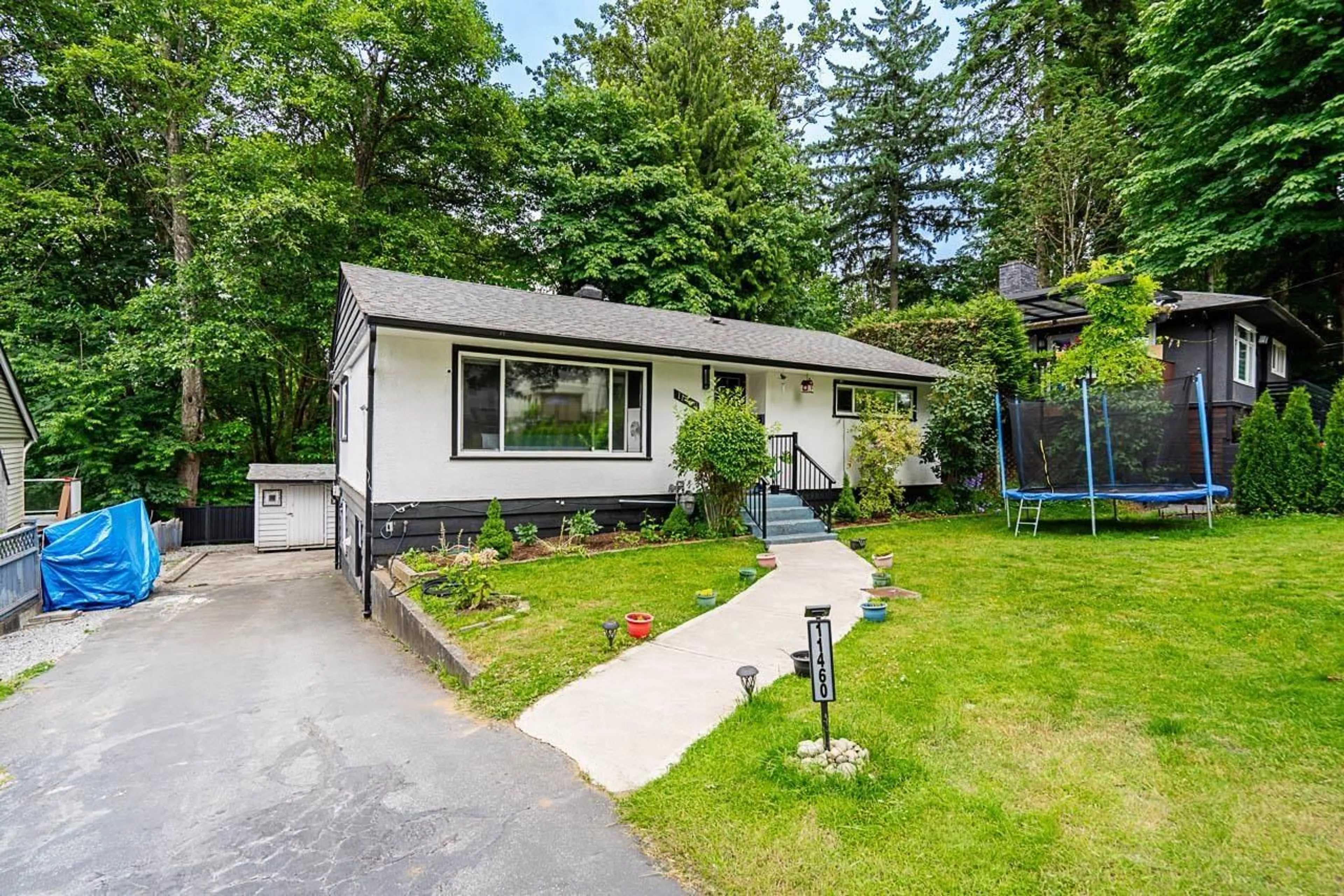 Home with vinyl exterior material, street for 11460 141A, Surrey British Columbia V3R3K2