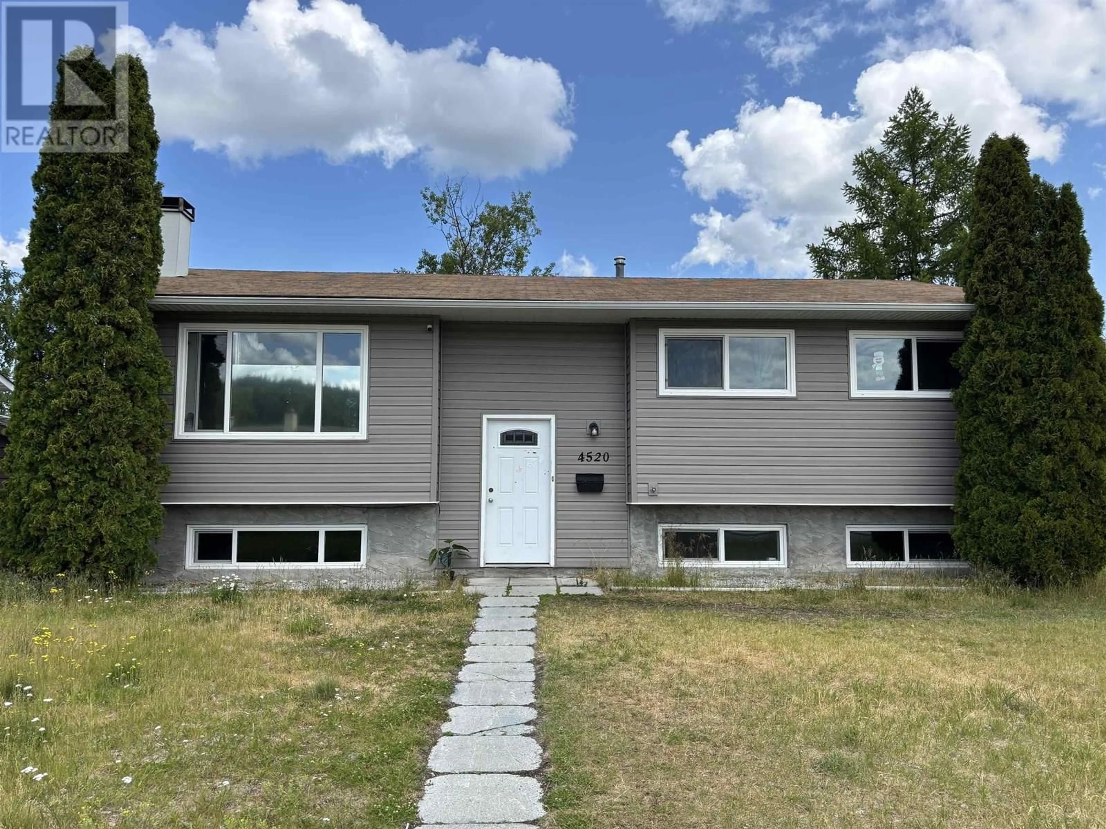 Home with vinyl exterior material, street for 4520 1ST AVENUE, Prince George British Columbia V2M3C8