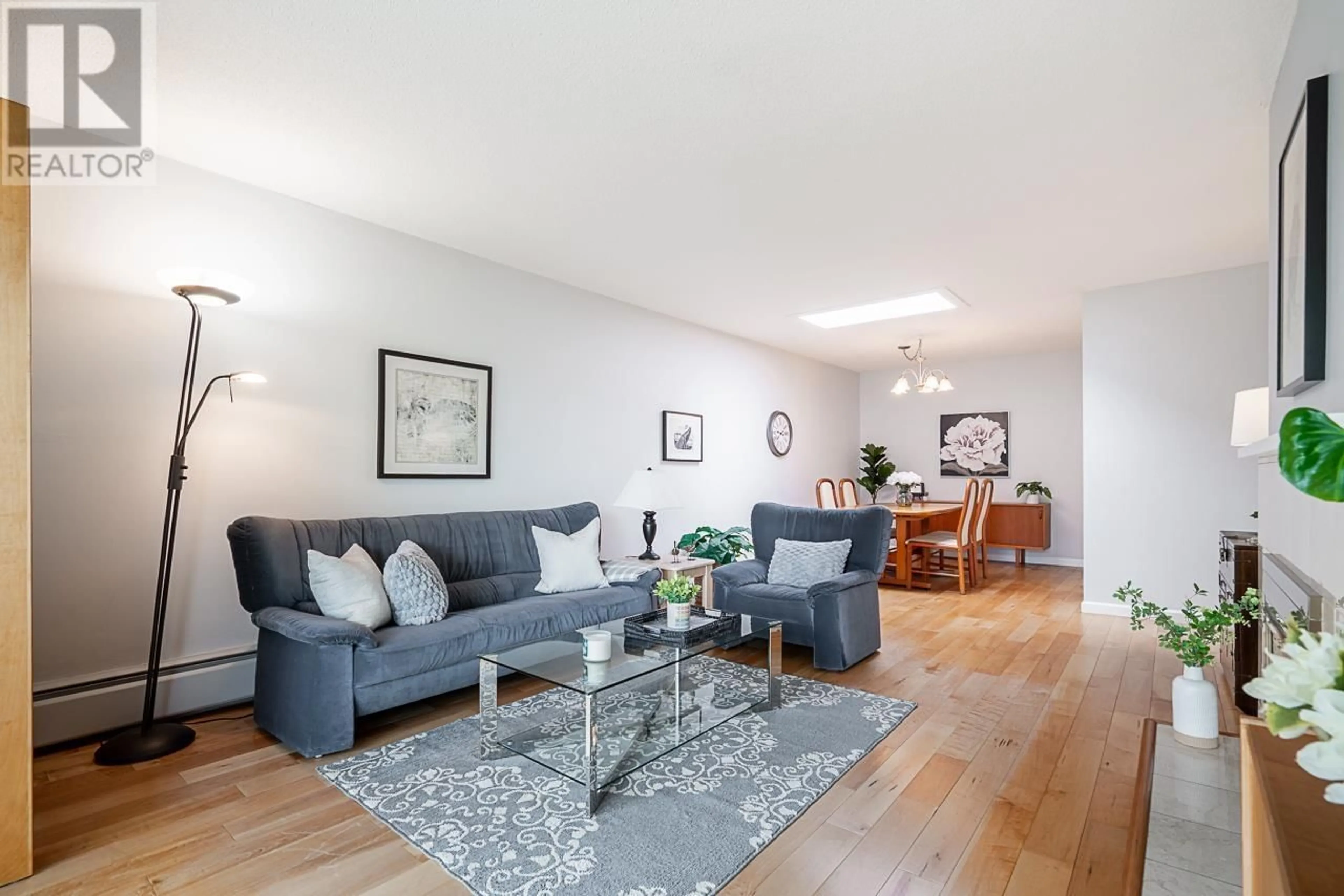 Living room with furniture, wood/laminate floor for 301 - 141 18TH STREET, North Vancouver British Columbia V7L2X3