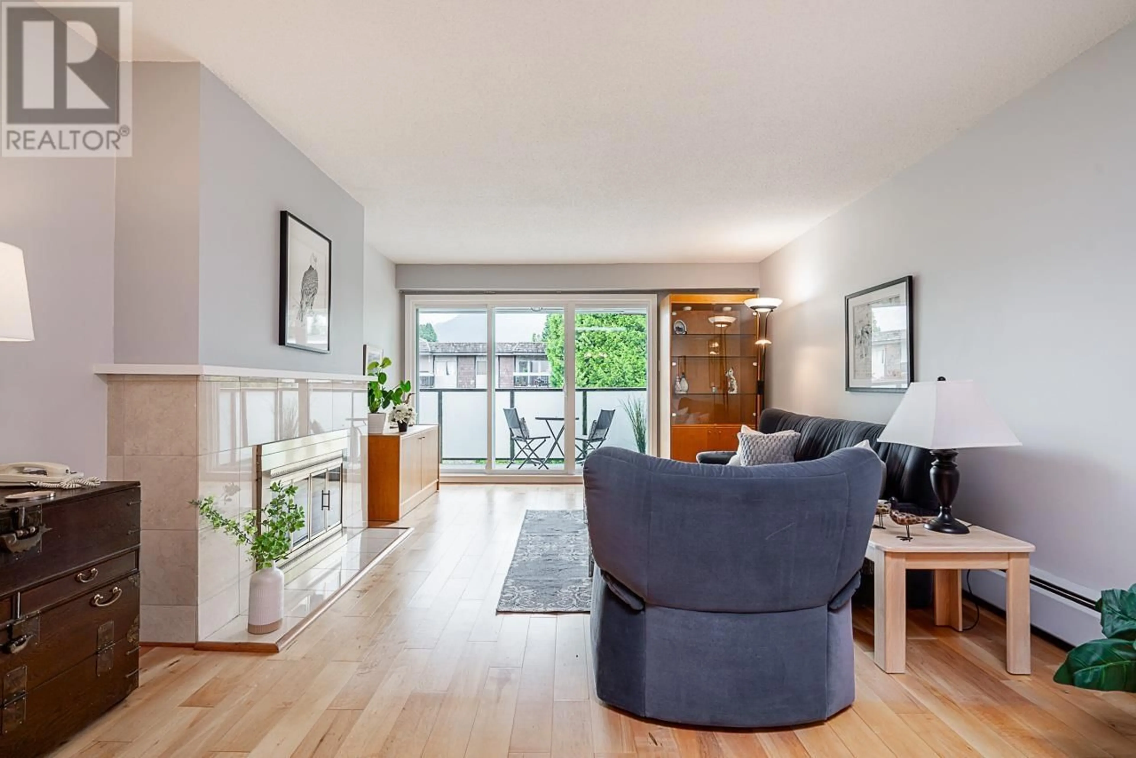 Living room with furniture, wood/laminate floor for 301 - 141 18TH STREET, North Vancouver British Columbia V7L2X3
