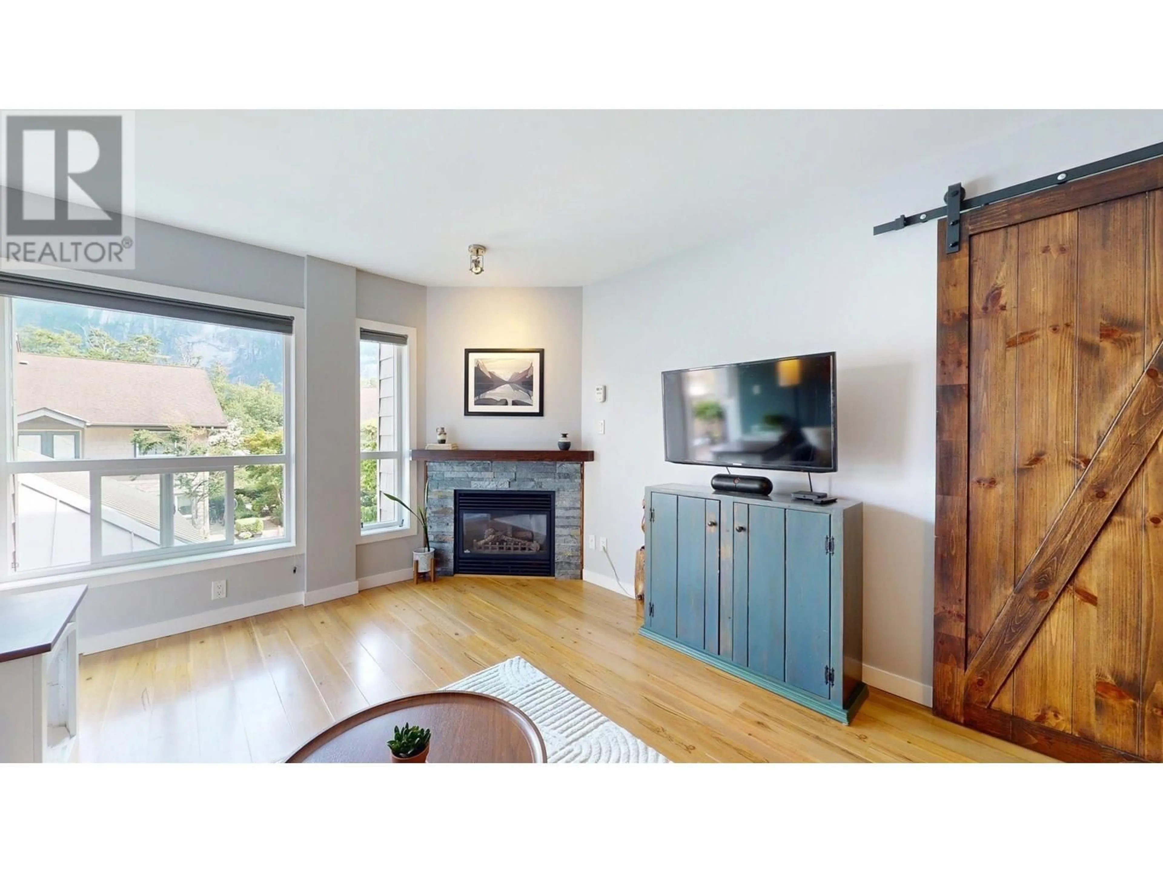 Living room with furniture, wood/laminate floor for 213 - 1212 MAIN STREET, Squamish British Columbia V8B0S1