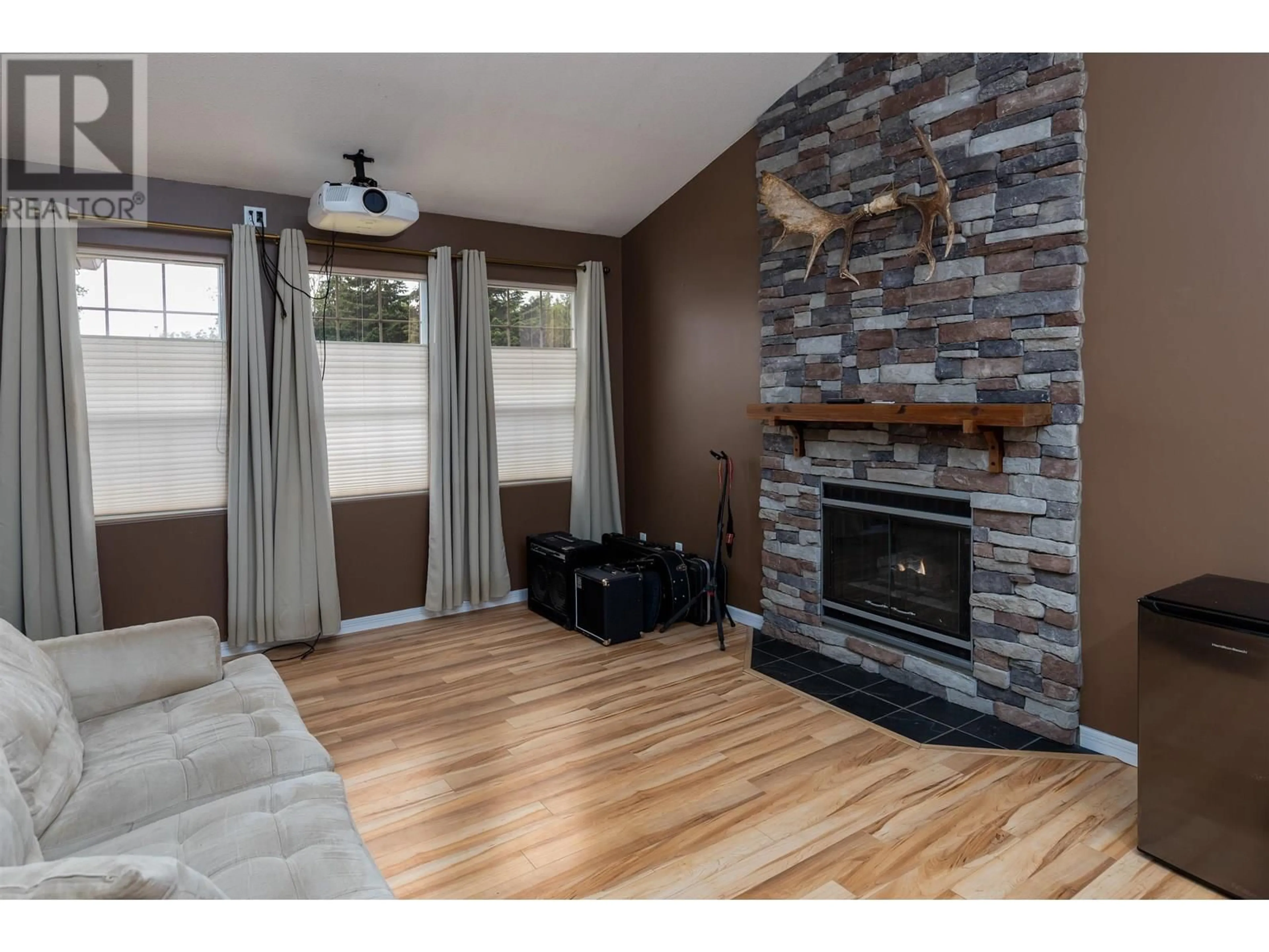 Living room with furniture, wood/laminate floor for 2084 WALNUT DRIVE, Terrace British Columbia V8G5E9