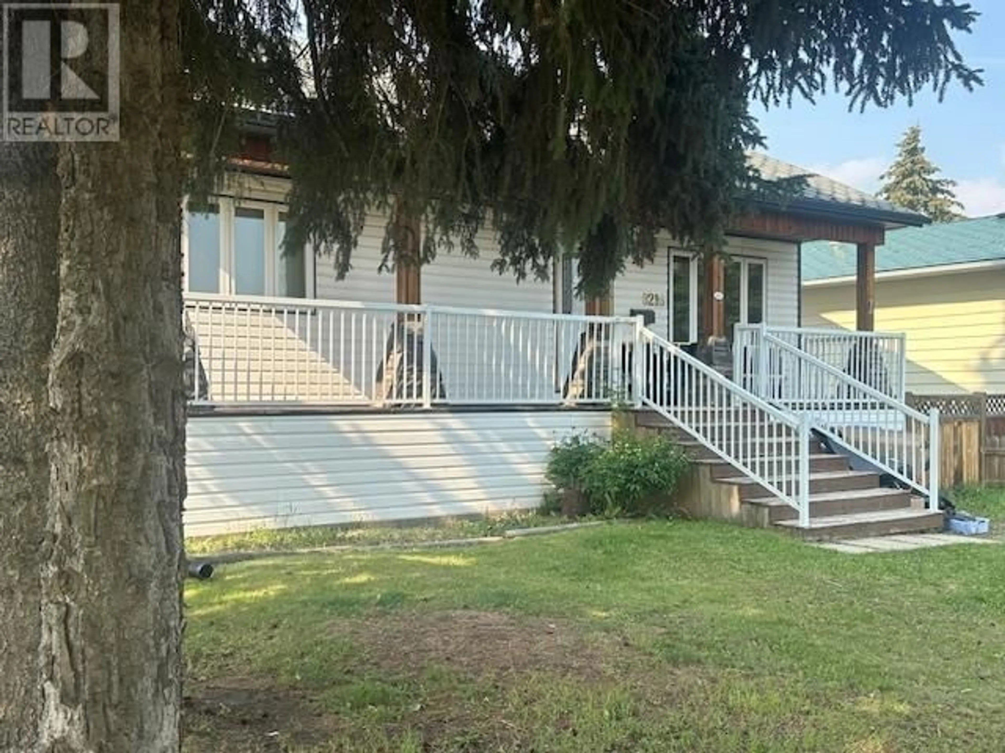 A pic from outside/outdoor area/front of a property/back of a property/a pic from drone, unknown for 8216 94 AVENUE, Fort St. John British Columbia V1J1E8