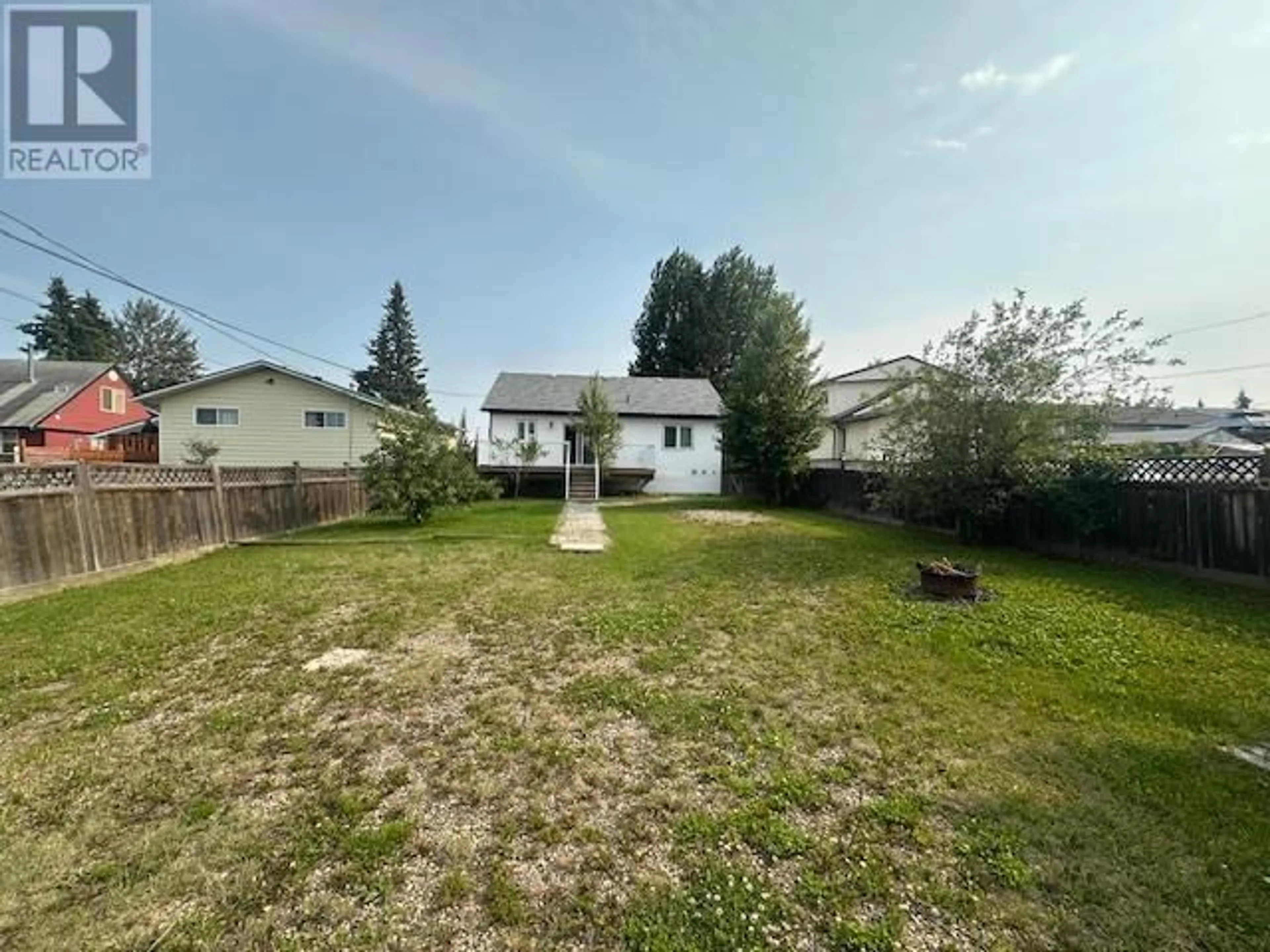 A pic from outside/outdoor area/front of a property/back of a property/a pic from drone, unknown for 8216 94 AVENUE, Fort St. John British Columbia V1J1E8