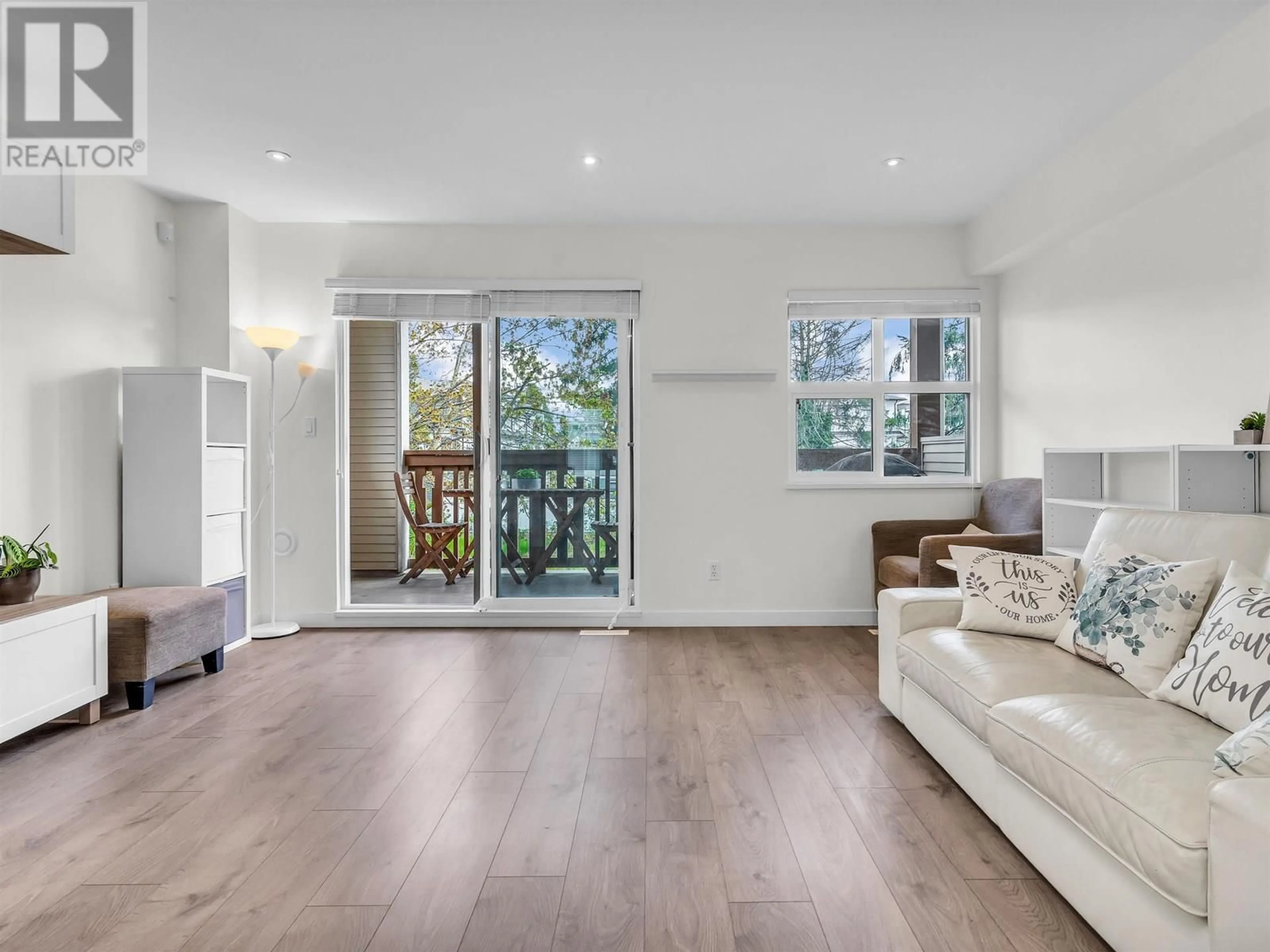 Living room with furniture, wood/laminate floor for 23 - 7100 LYNNWOOD DRIVE, Richmond British Columbia V7C5S8