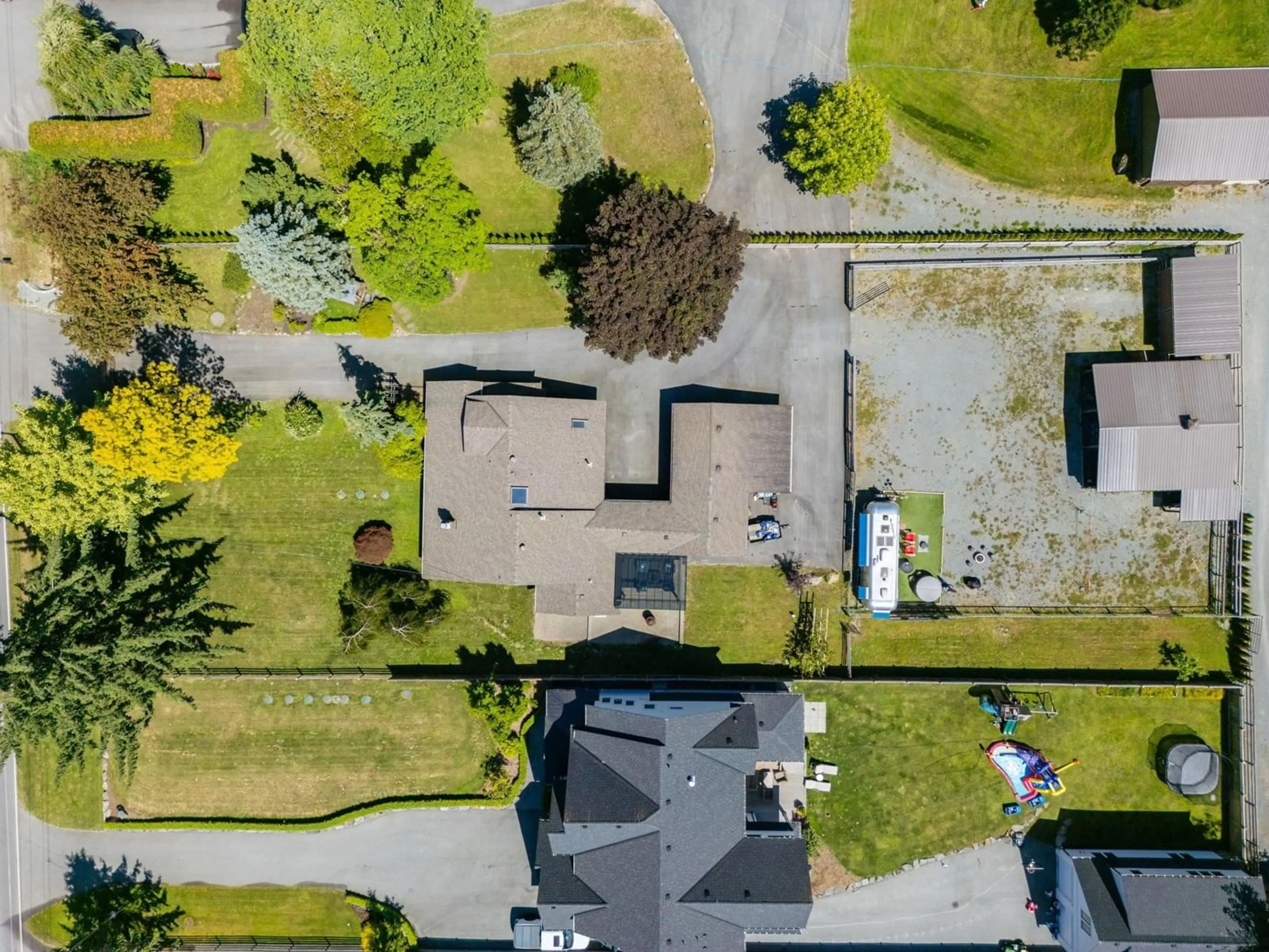 A pic from outside/outdoor area/front of a property/back of a property/a pic from drone, street for 1144 216, Langley British Columbia V2Z1R3