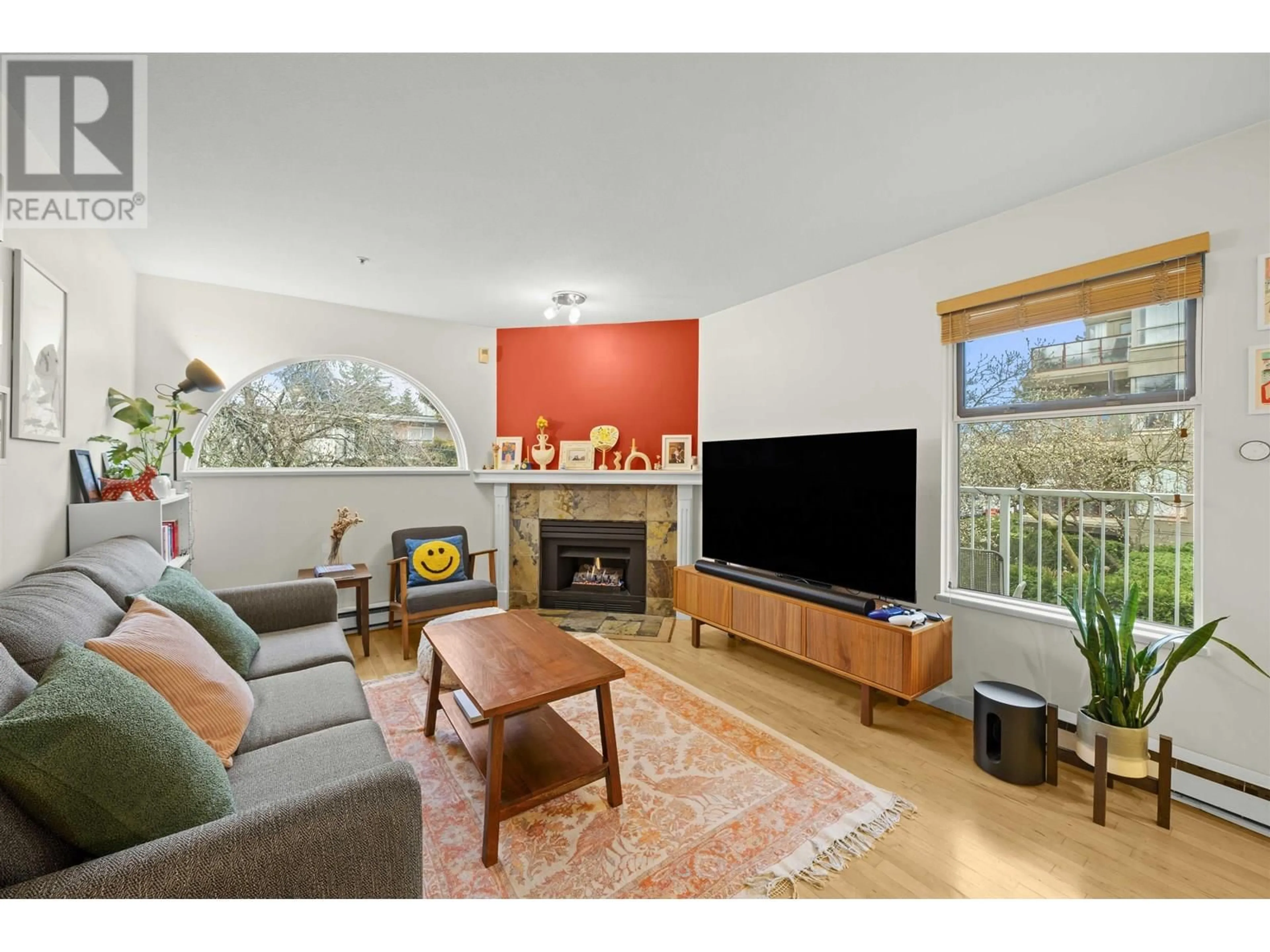 Living room with furniture, wood/laminate floor for 201 - 1868 8TH AVENUE, Vancouver British Columbia V6J5G3