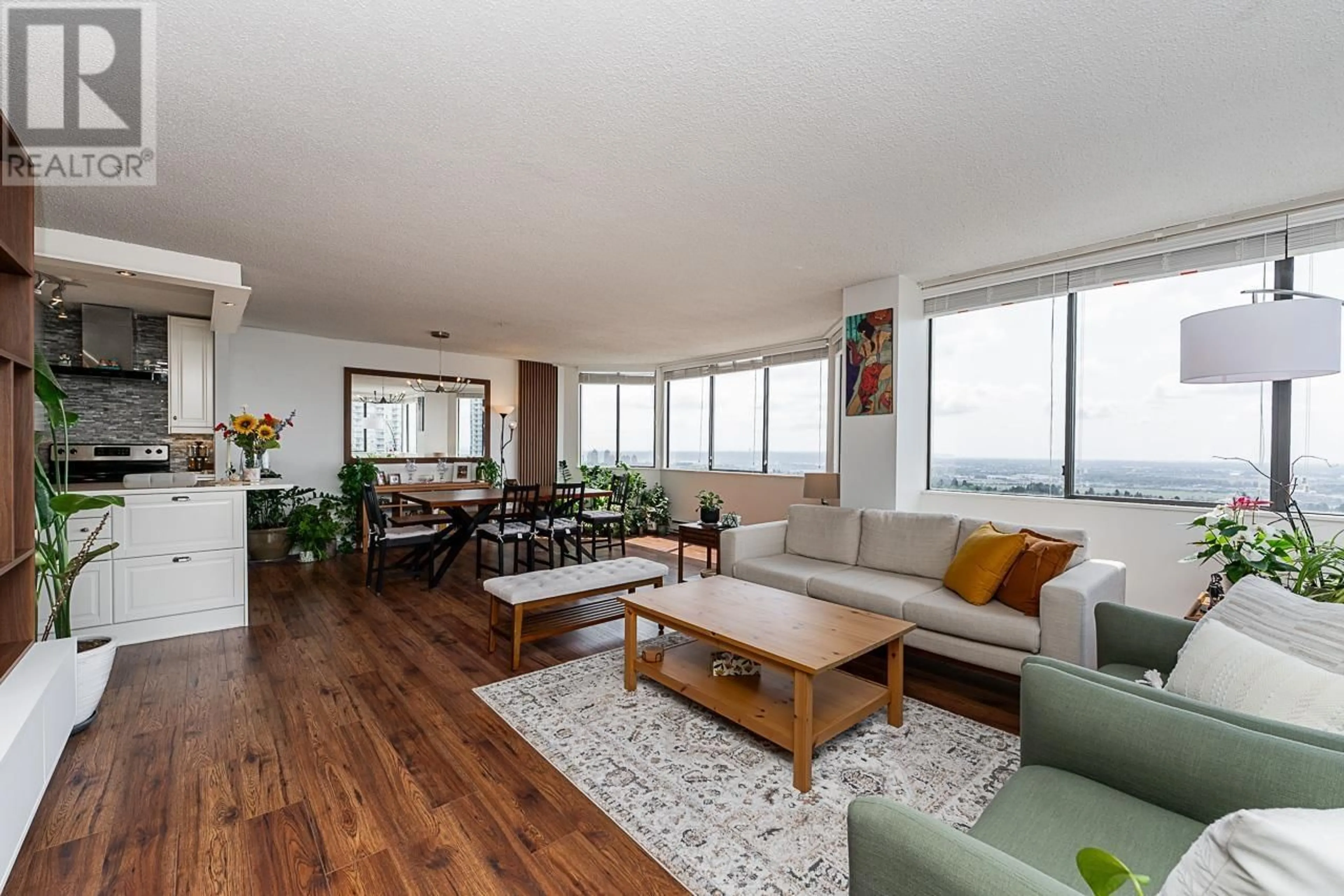 Living room with furniture, wood/laminate floor for 2505 - 6540 BURLINGTON AVENUE, Burnaby British Columbia V5H4G3