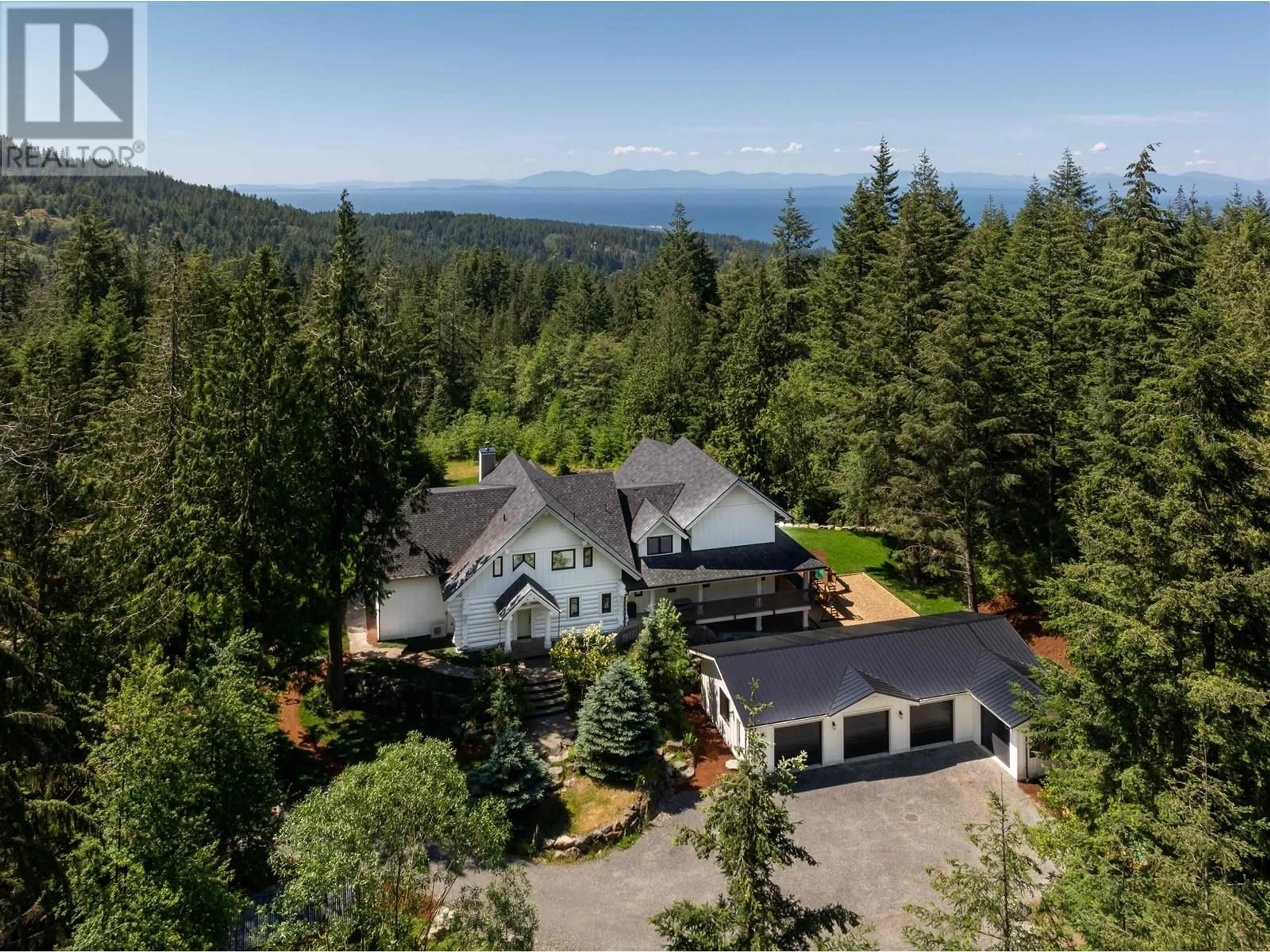 A pic from outside/outdoor area/front of a property/back of a property/a pic from drone, mountain view for 650 LAURA ROAD, Bowen Island British Columbia V0N1G2