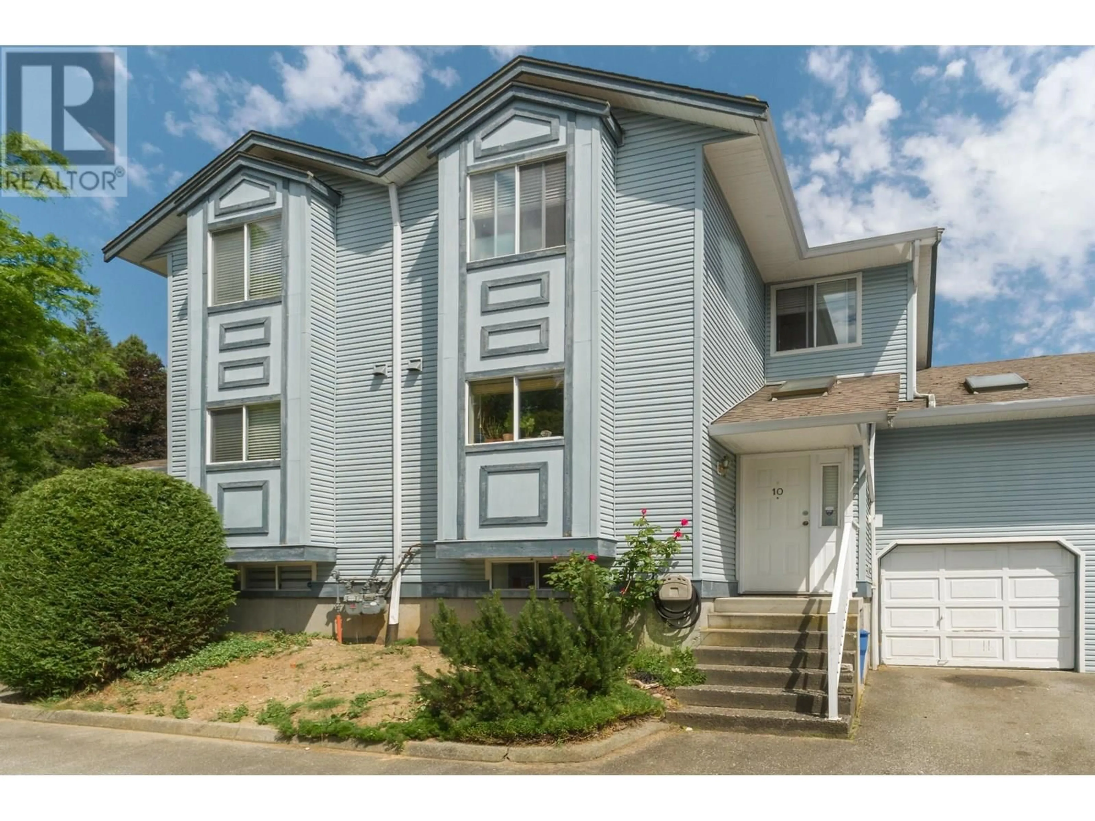 Home with vinyl exterior material, street for 10 - 19252 119TH AVENUE, Pitt Meadows British Columbia V3Y2K4