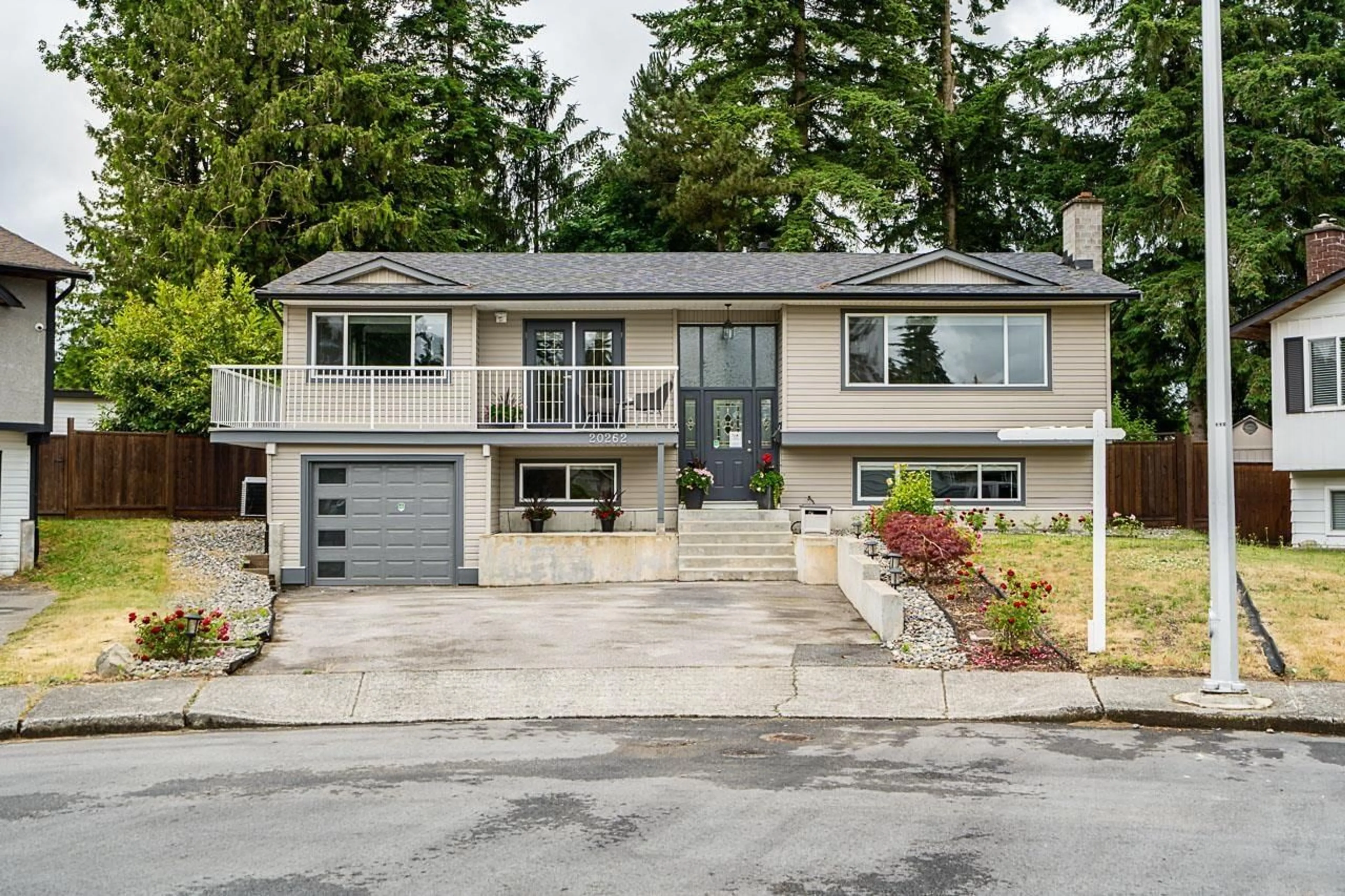 Home with vinyl exterior material, street for 20262 46A, Langley British Columbia V3A5K4