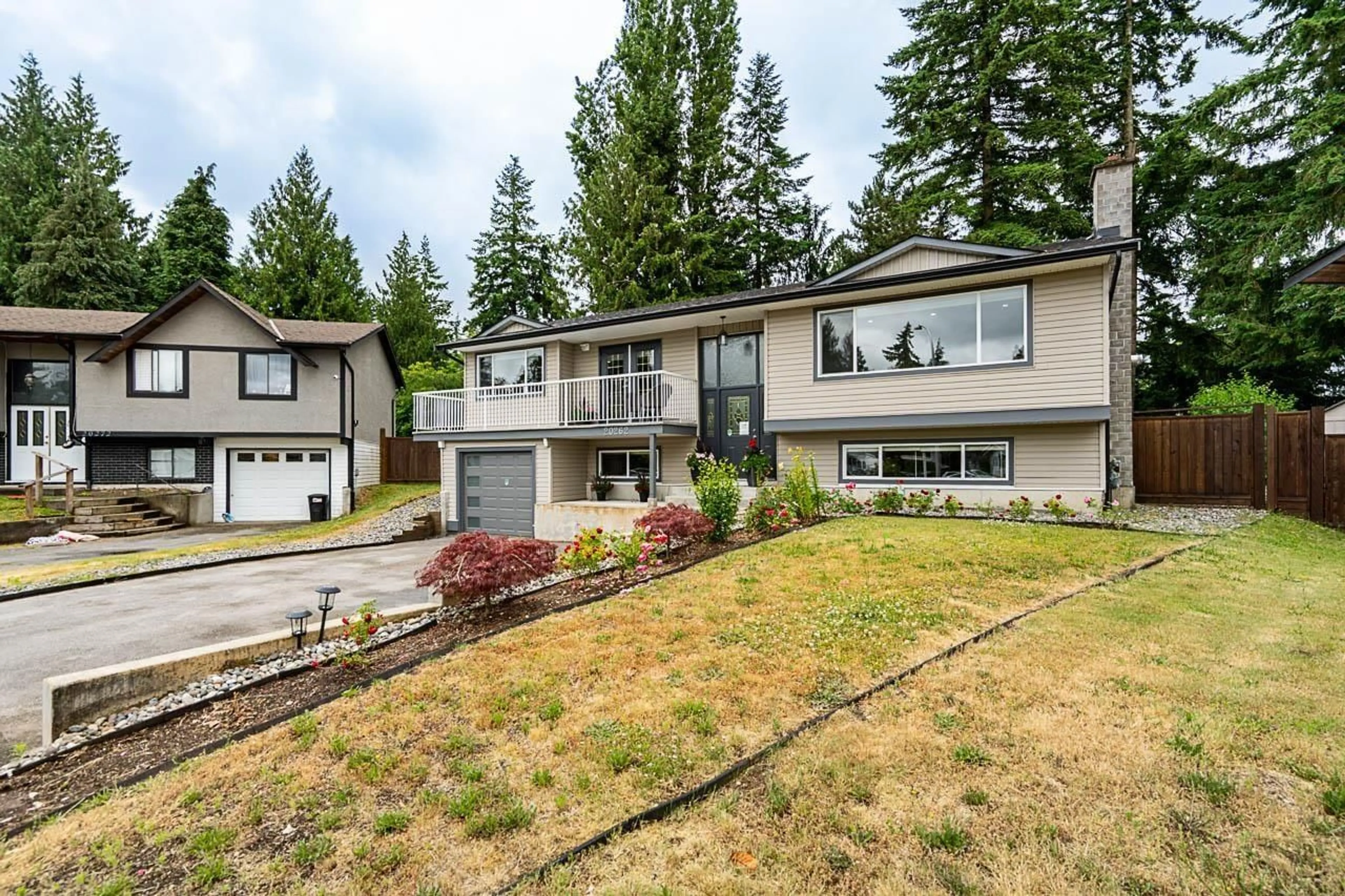 Home with vinyl exterior material, street for 20262 46A, Langley British Columbia V3A5K4
