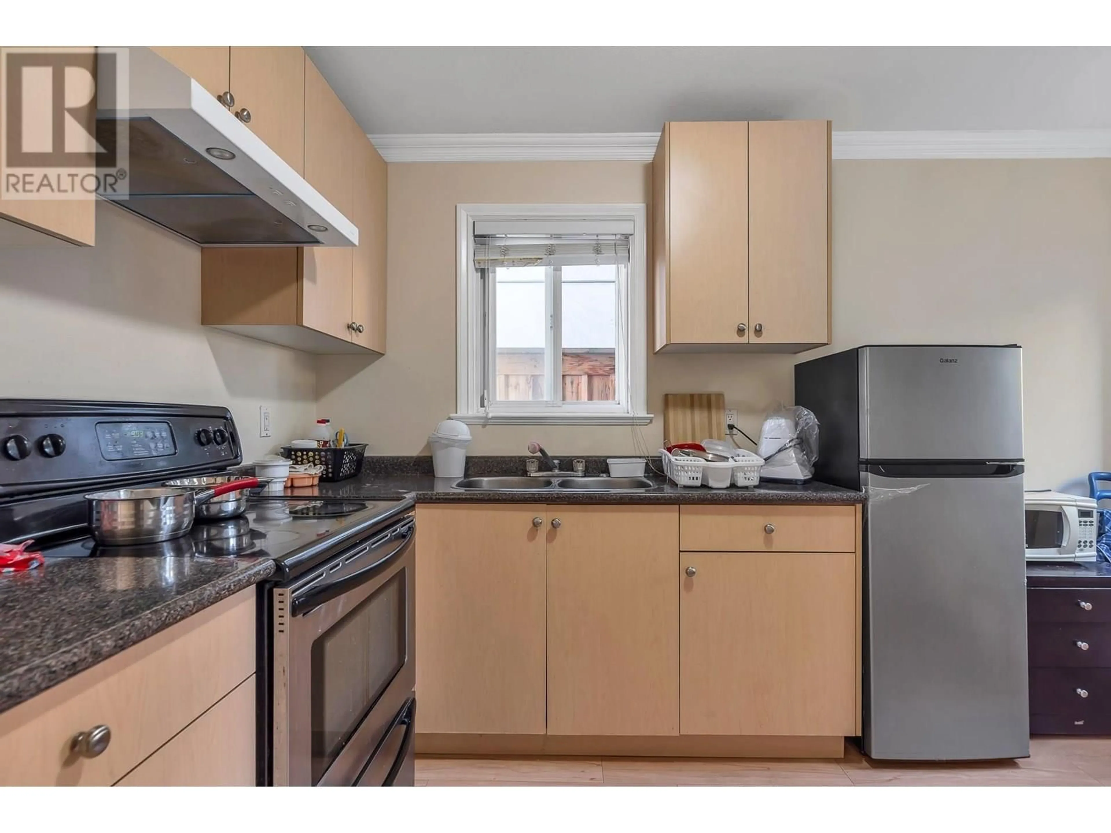 Standard kitchen, wood/laminate floor for 7531 OAK STREET, Vancouver British Columbia V6P4A4
