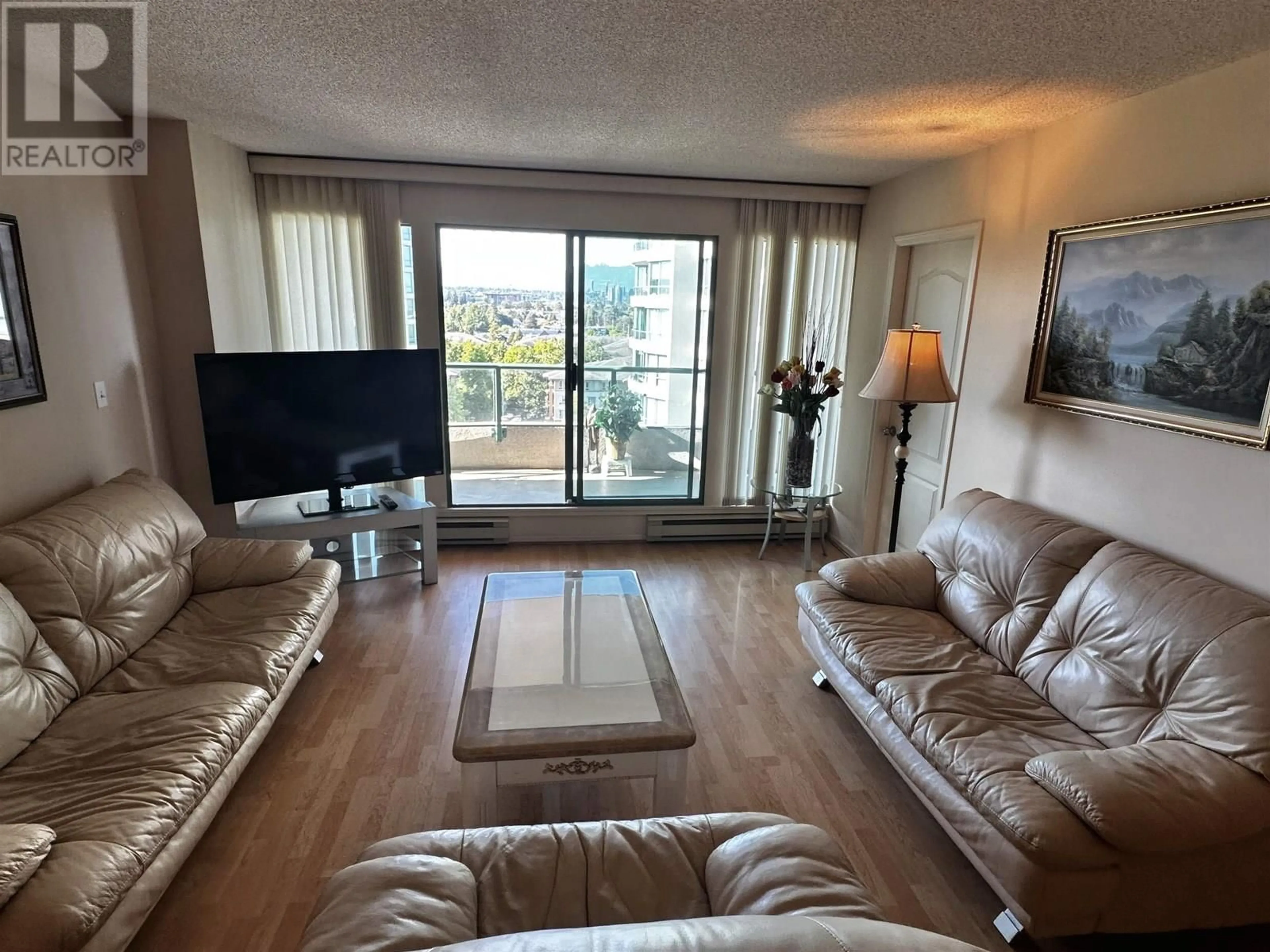 Living room with furniture, wood/laminate floor for 1105 - 8831 LANSDOWNE ROAD, Richmond British Columbia V6X3T5