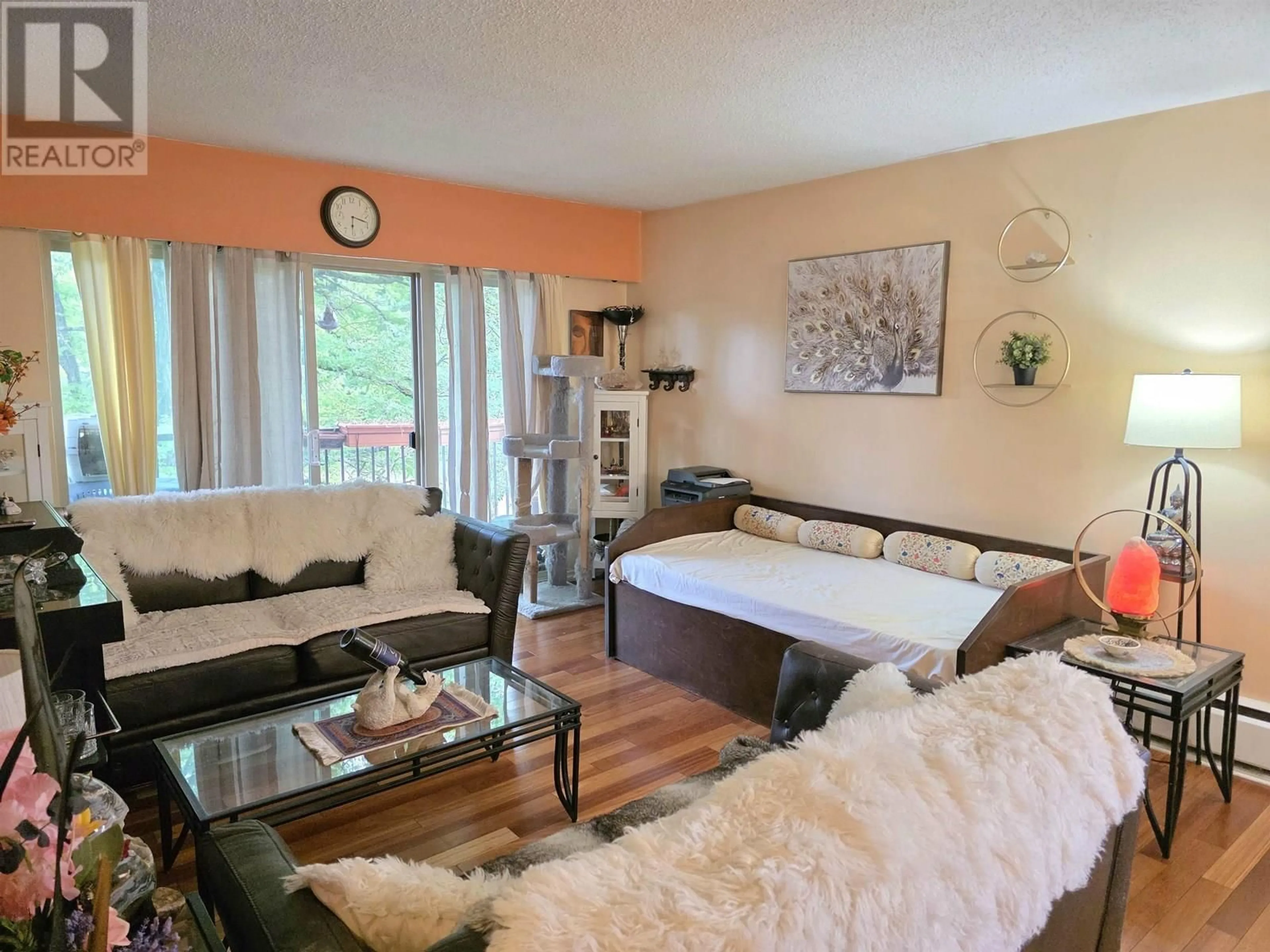 Living room with furniture, wood/laminate floor for 309 - 225 3RD STREET, North Vancouver British Columbia V7M1E9
